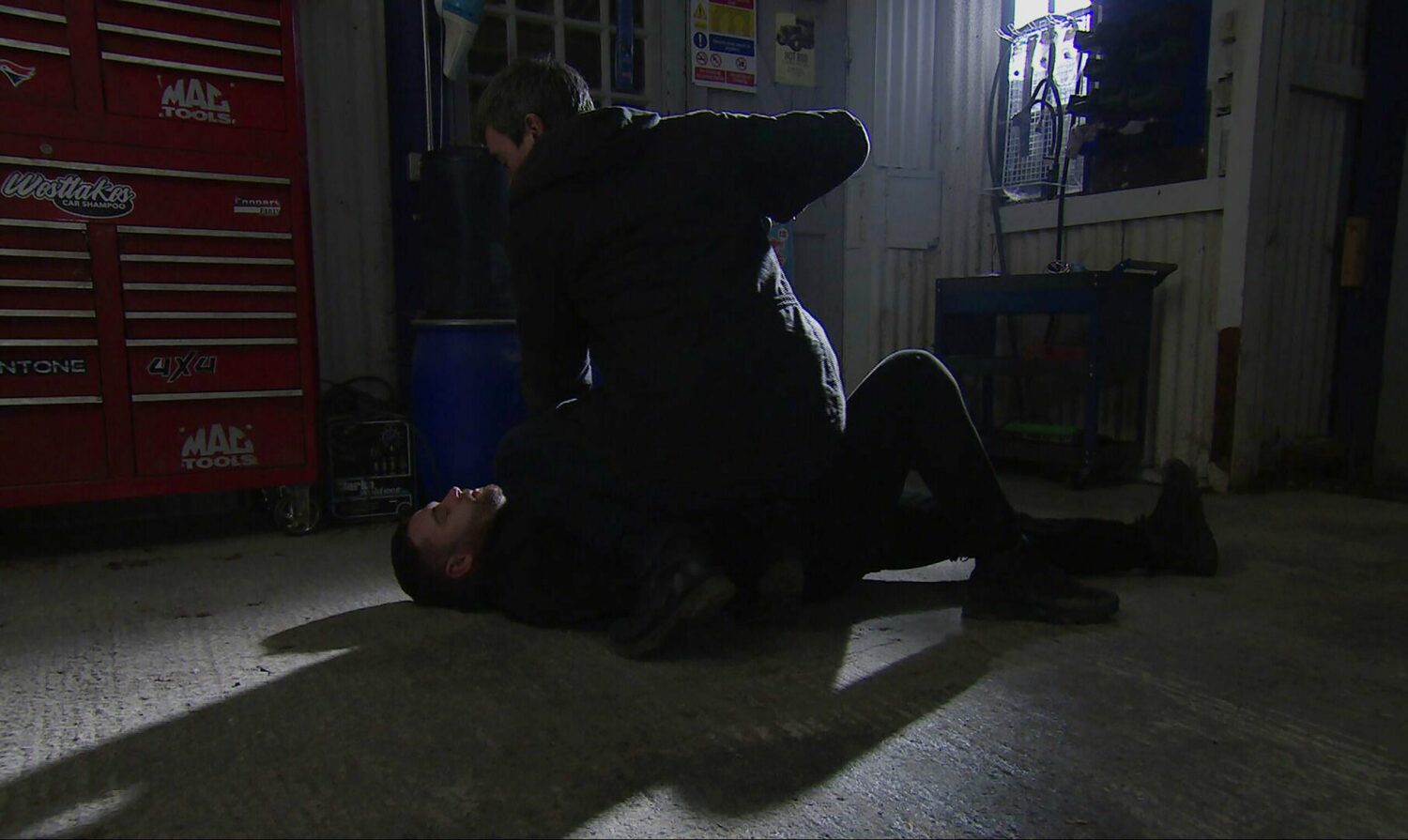 Cain and Aaron fight in the garage