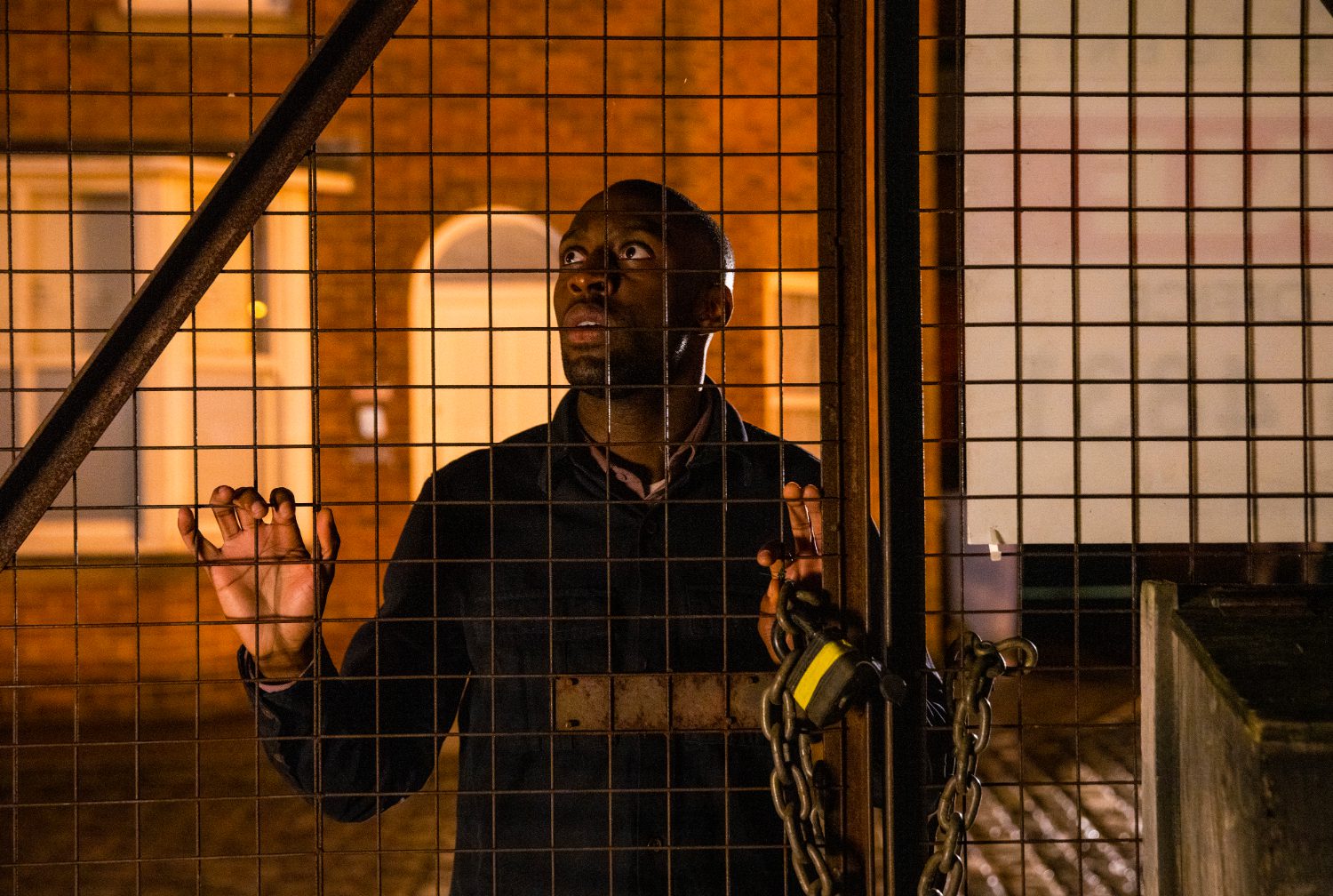 Coronation Street's Michael is holding on to the builder's yard gate with worry