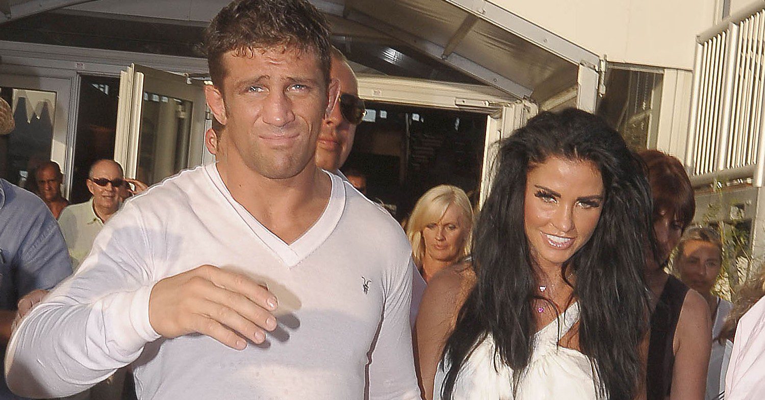 Alex Reid and Katie Price smile at event