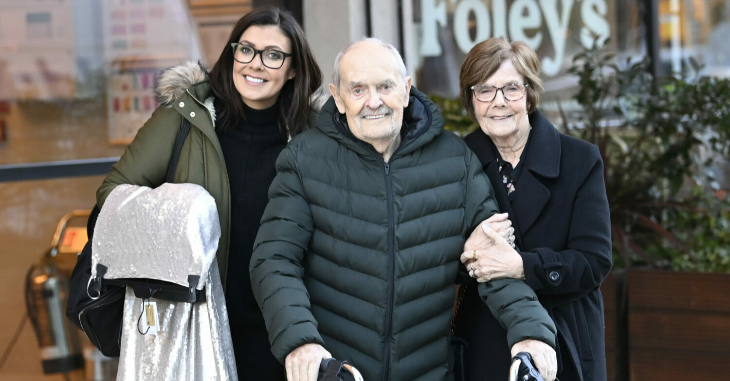 Kym Marsh, her dad David, and mum Pauline smile together 