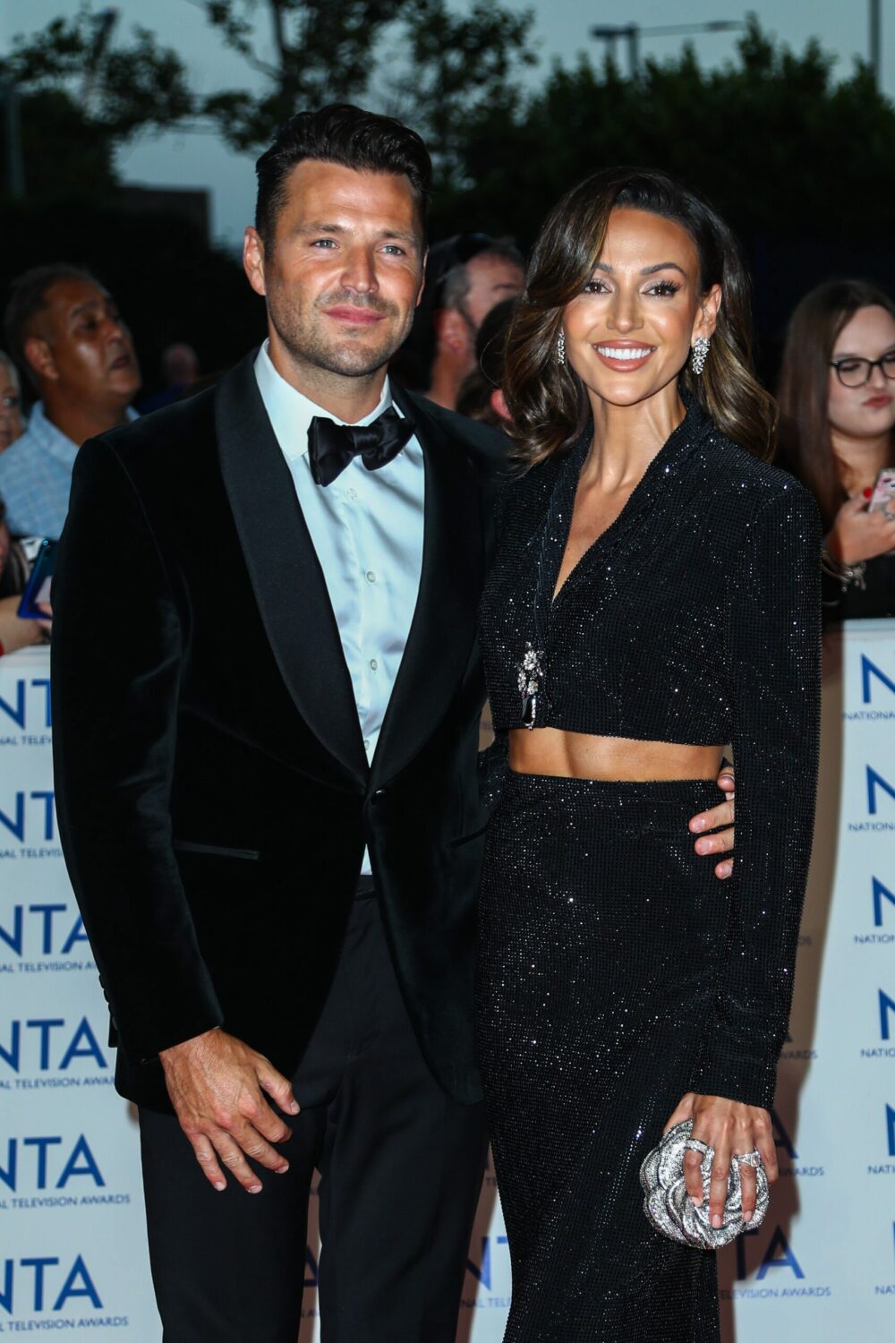 Mark Wright and Michelle Keegan smile on the red carpet in all black