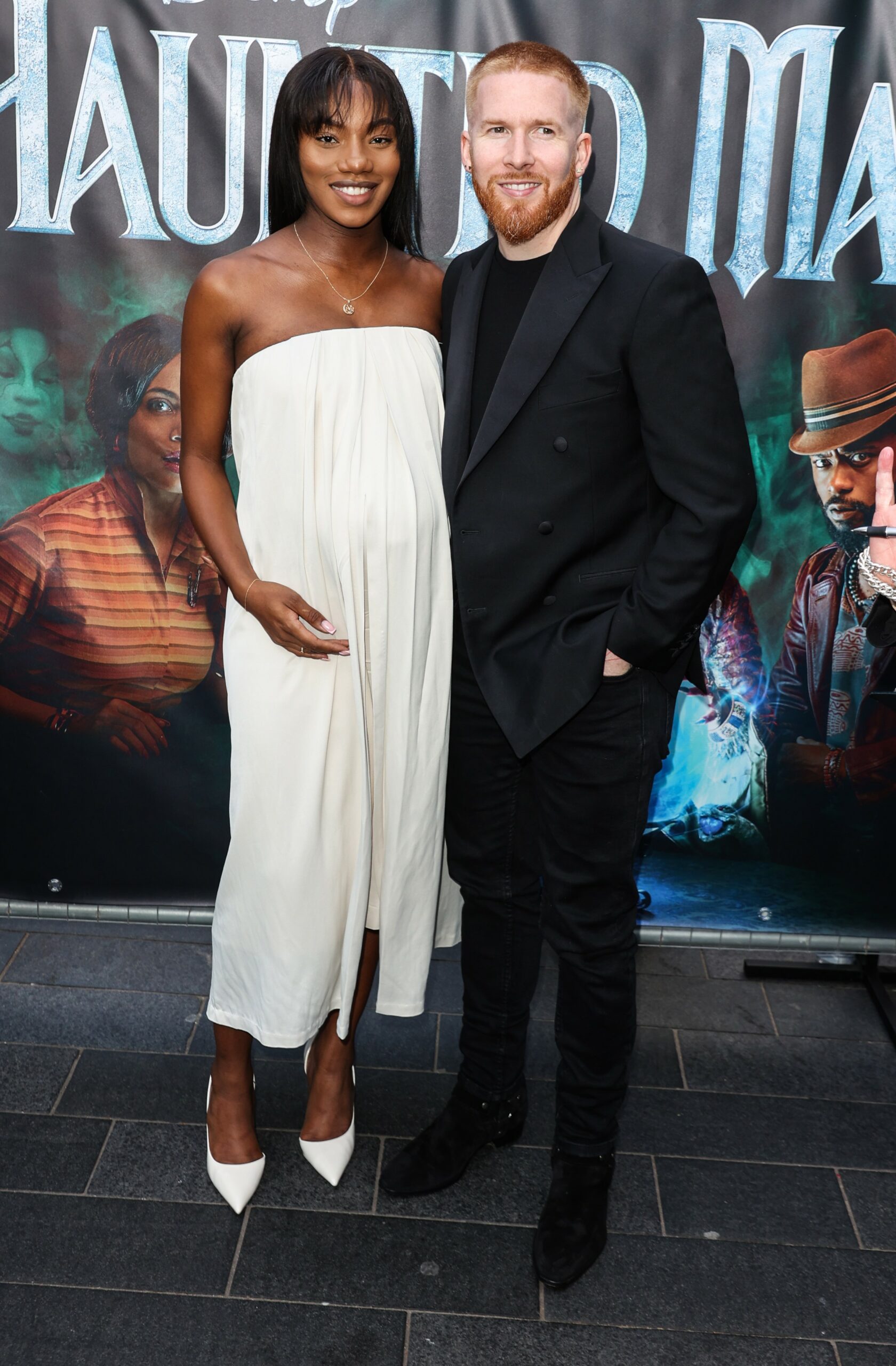 Chyna Mills and Neil Jones smiling at event