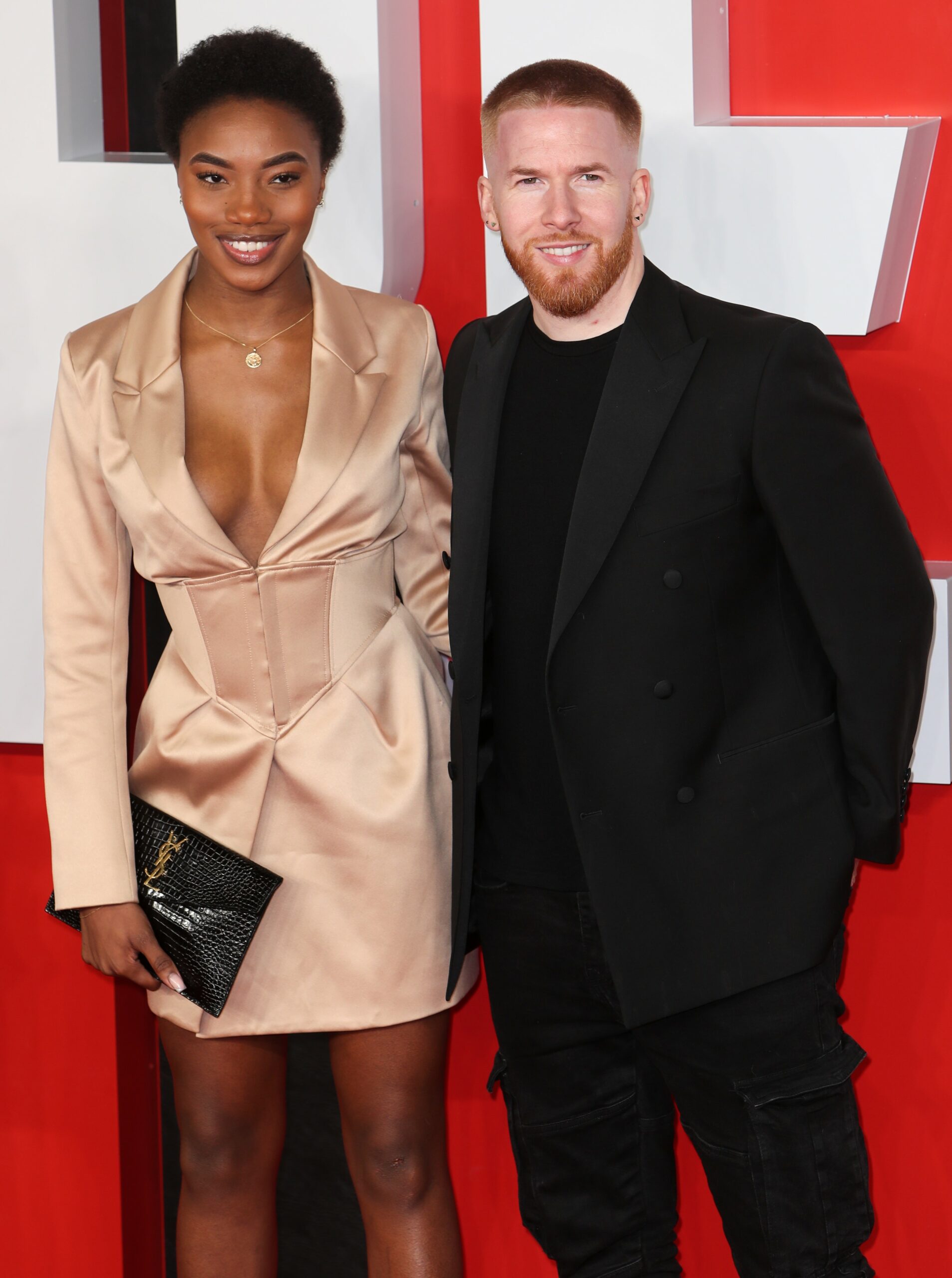 Chyna Mills and Neil Jones smiling at movie premiere