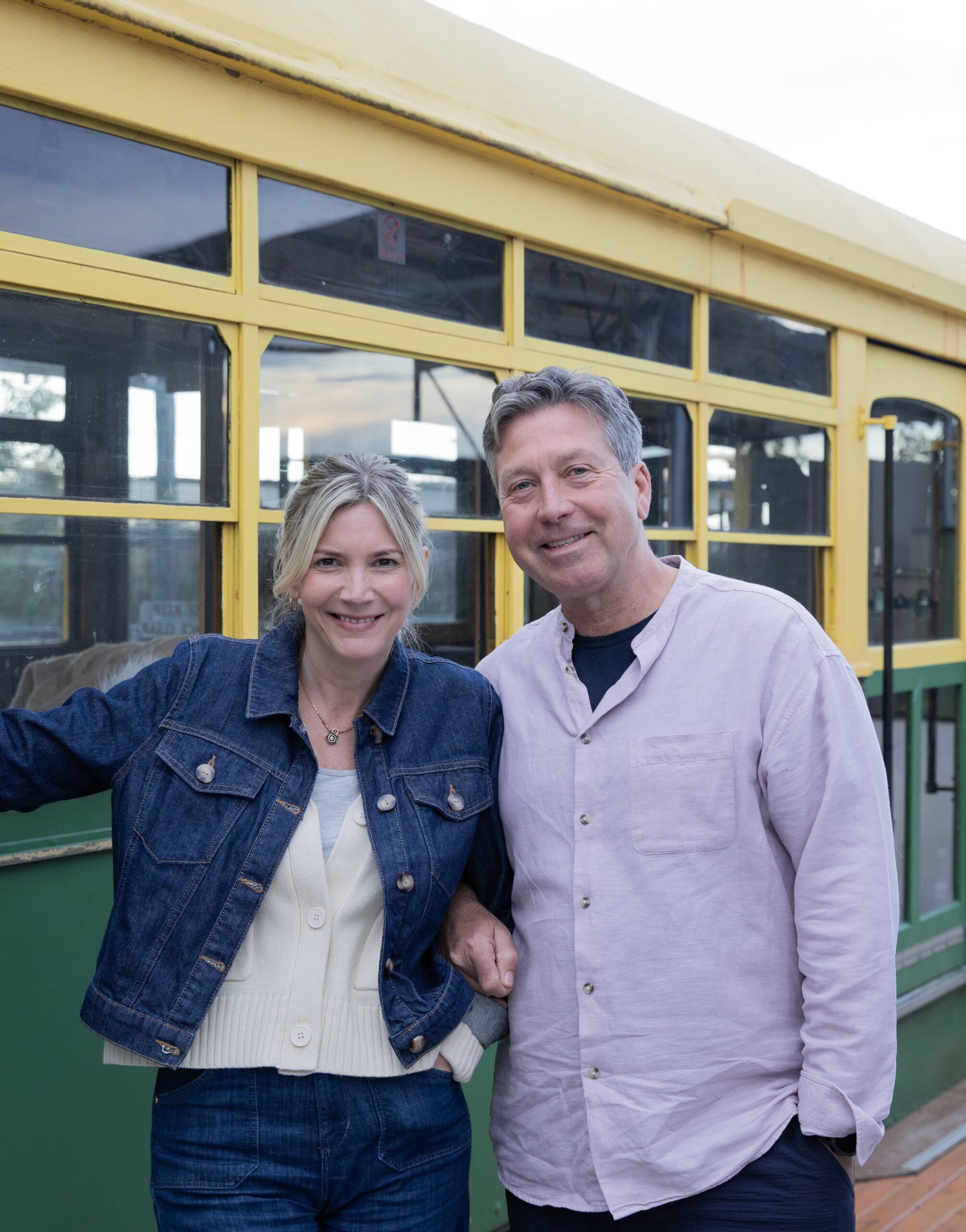 Lisa Faulkner and John Torode stand in front of a train in Australia