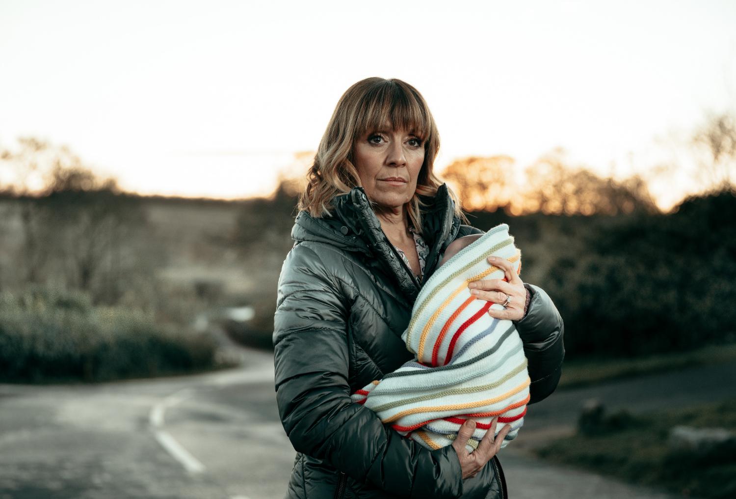 Emmerdale's Rhona is cradling baby Ivy outside