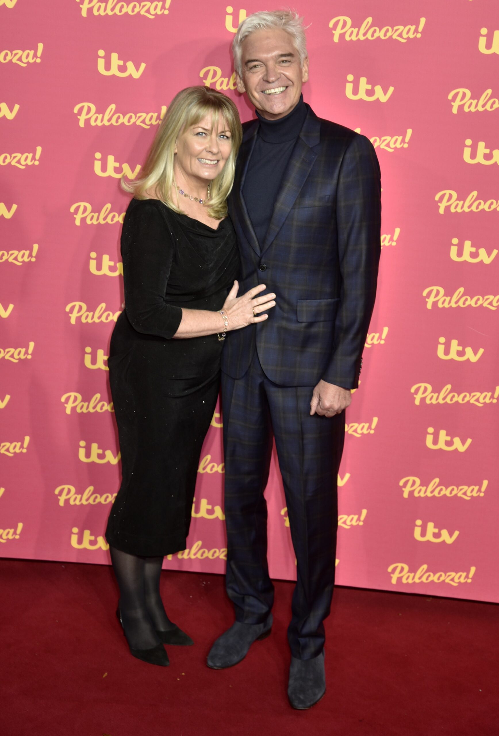 Phillip Schofield smiling with wife Steph at ITV Palooza