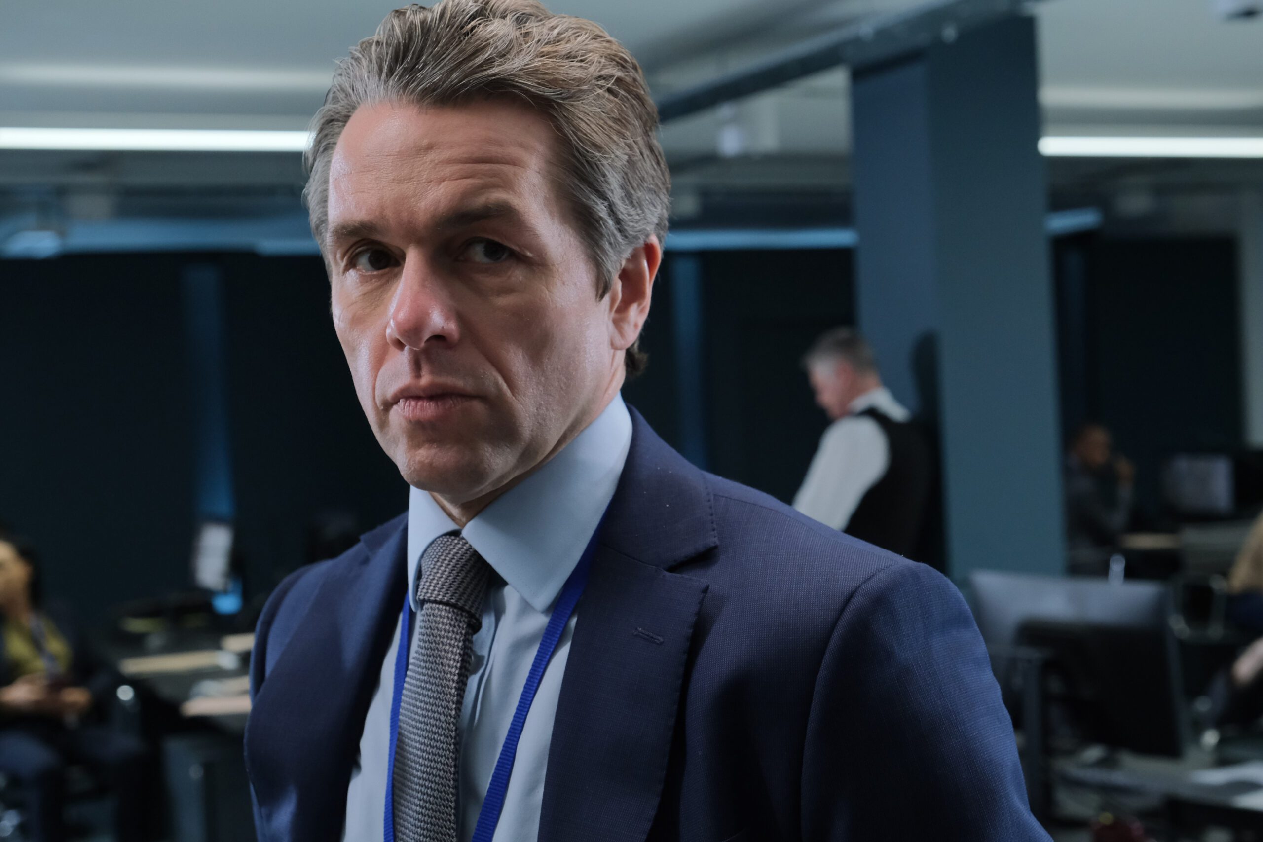 Julian Ovenden in blue suit as Francis in Trigger Point