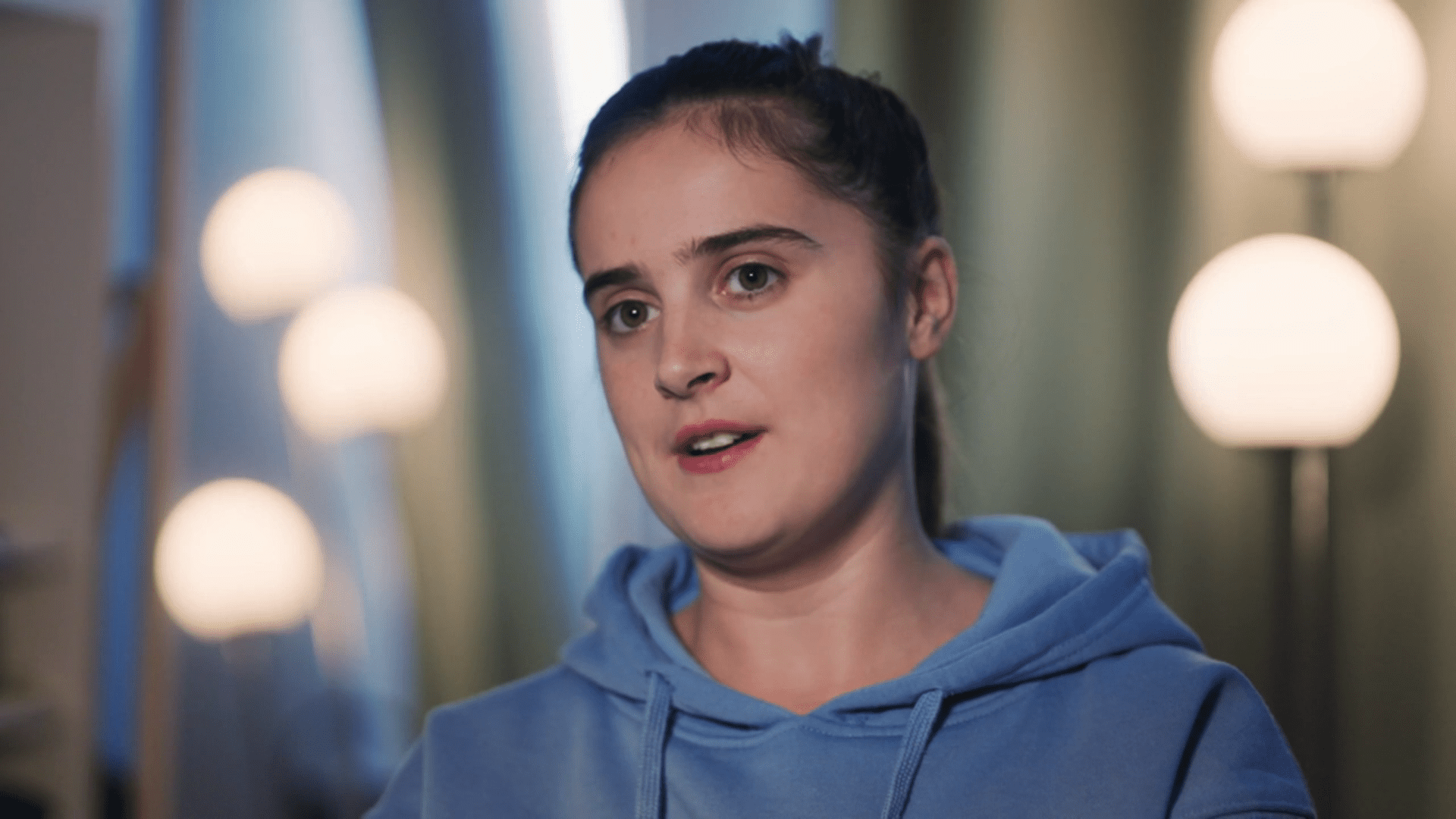 Katie Radford wearing a blue hoodie