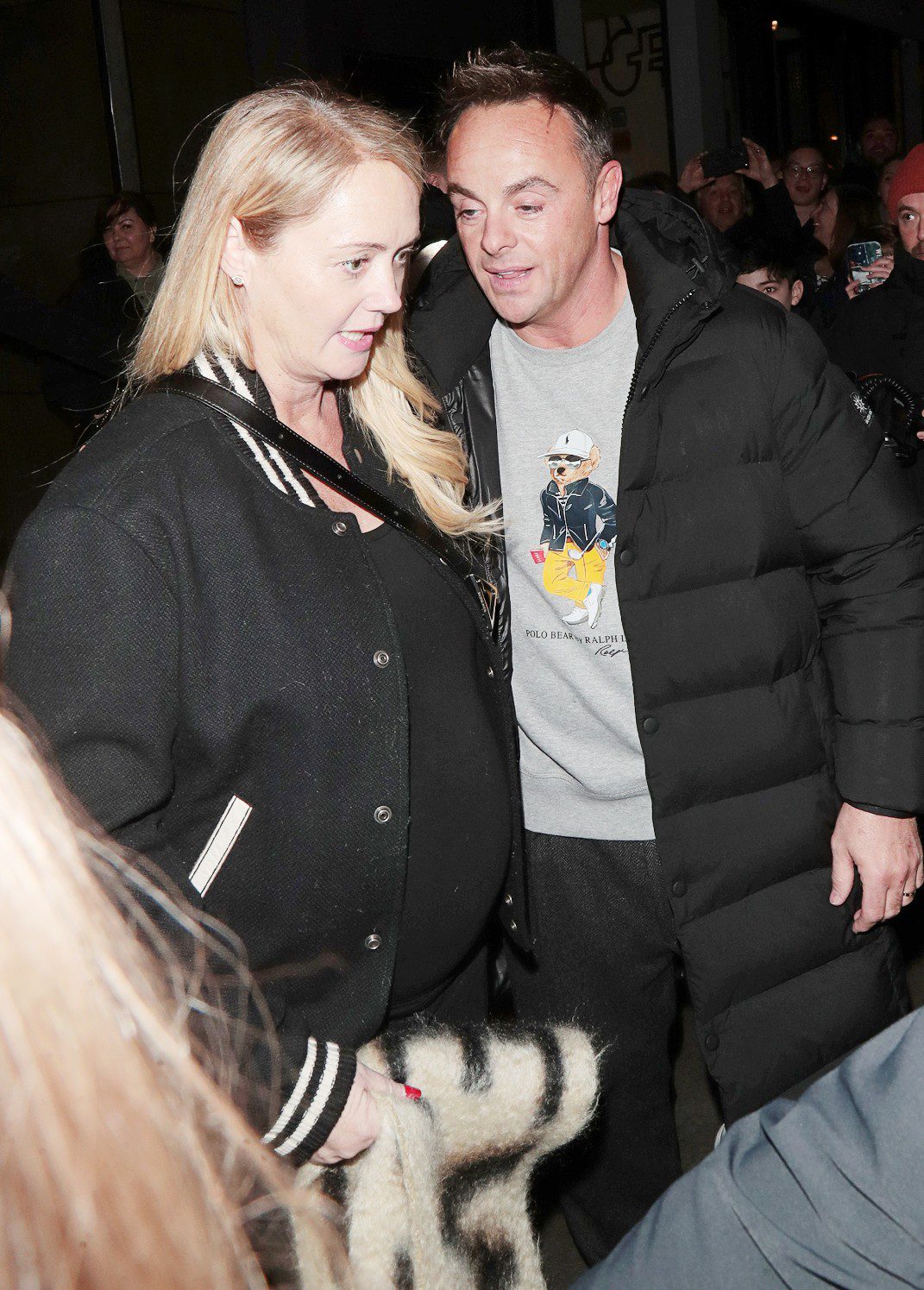 Anne-Marie and Ant McPartlin wearing black and showing off a baby bump
