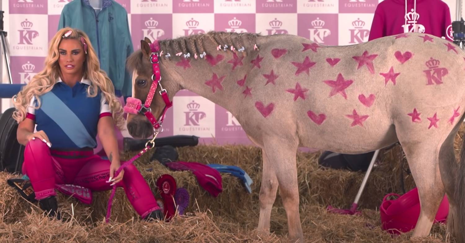 Katie Price pets a horse