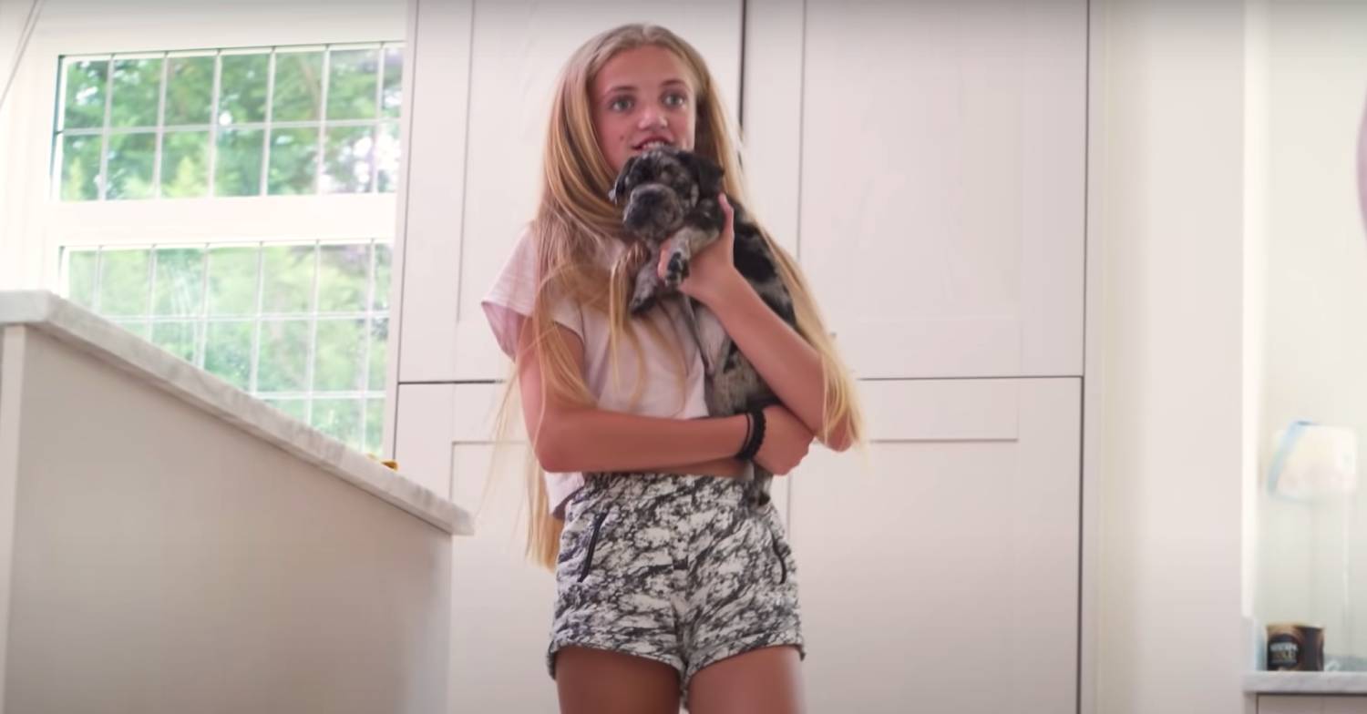 Princess holds a puppy