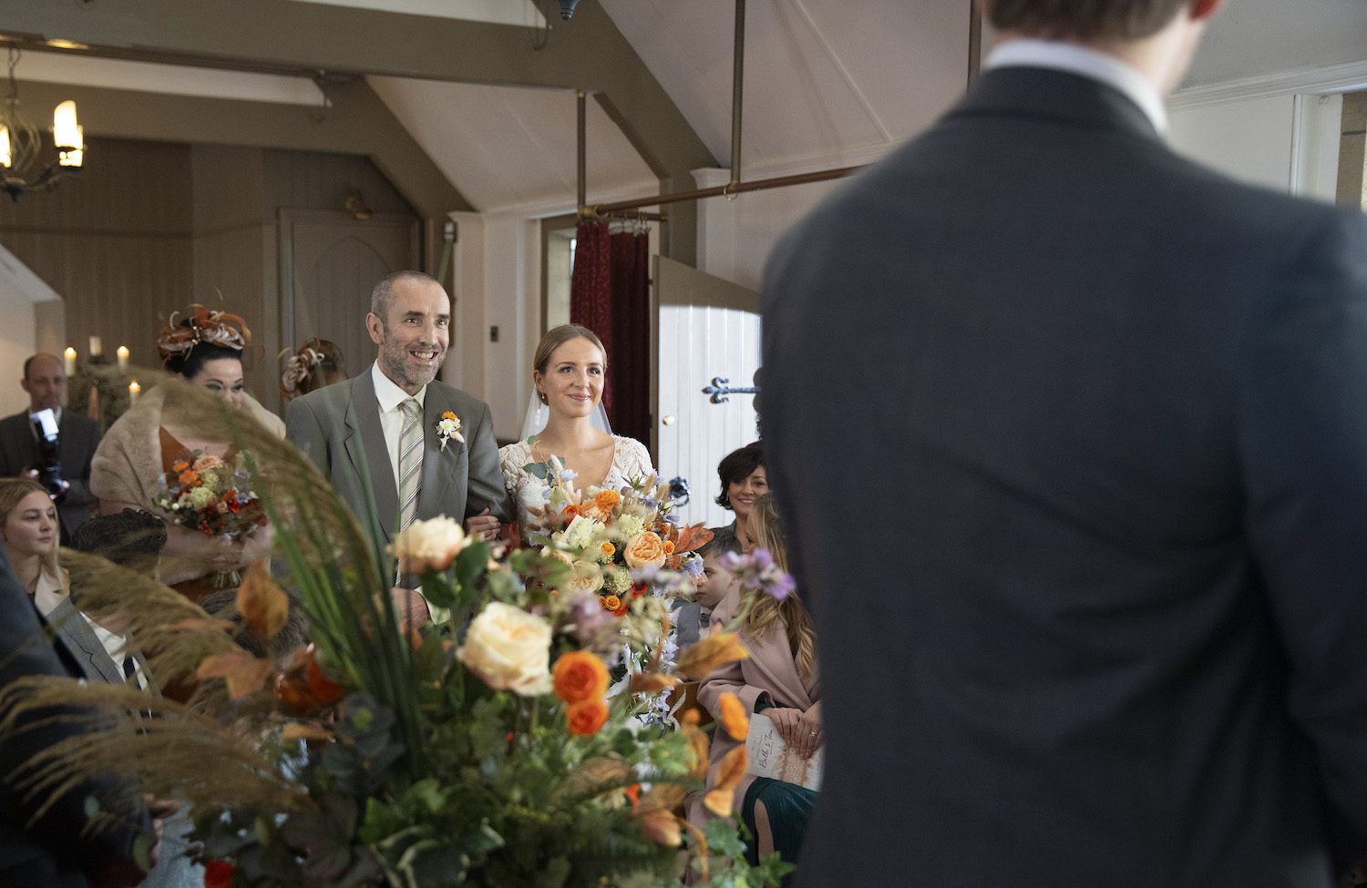 Sam Dingle beams as he walks smiling Belle Dingle down the aisle.