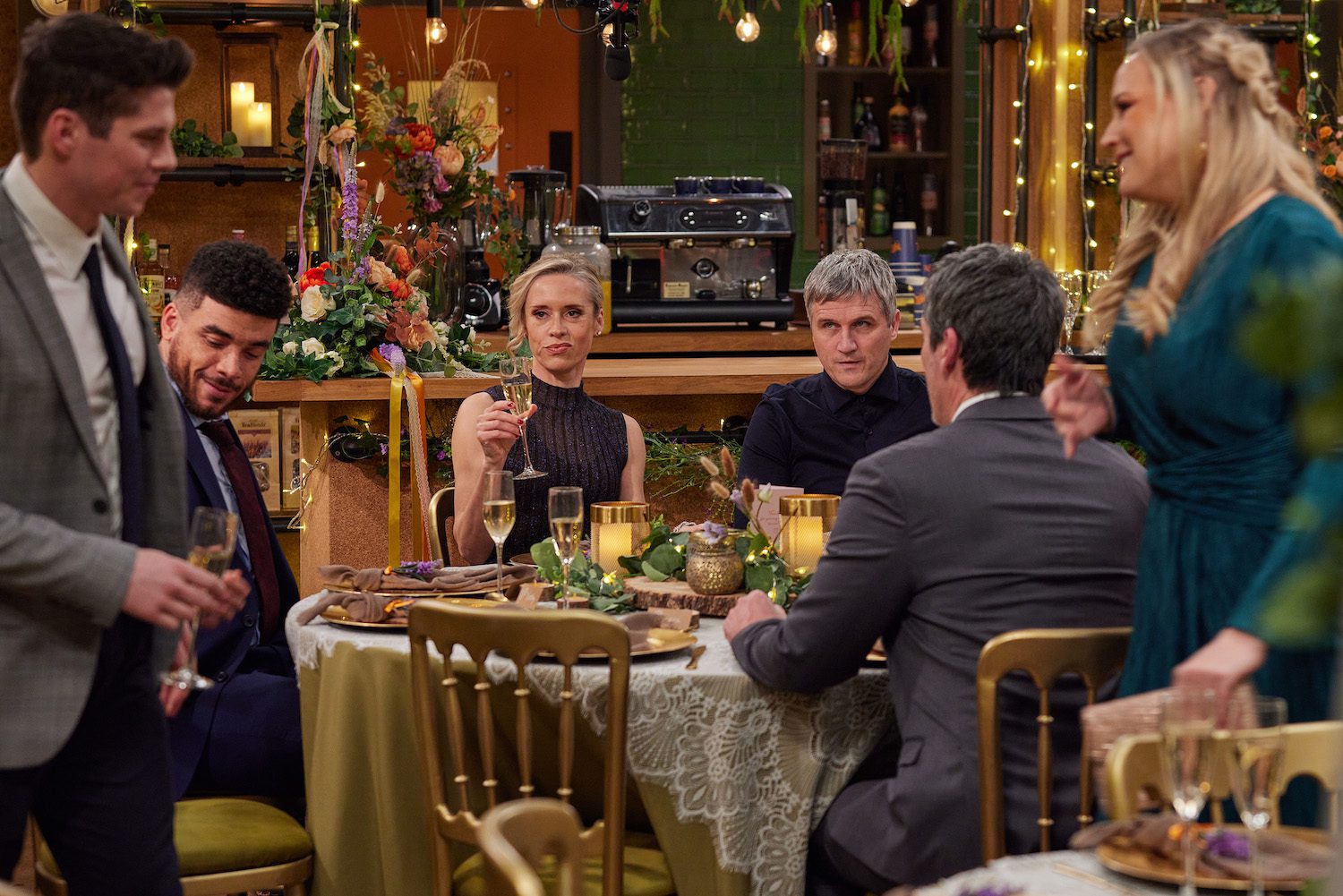 At the wedding reception in Emmerdale Ruby looks scorned with a glass of Champagne and Caleb looks concered