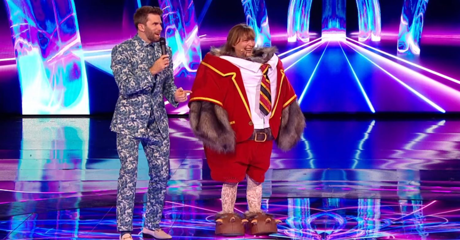 Lorraine Kelly as Owl on The Masked Singer next to host Joel Dommett