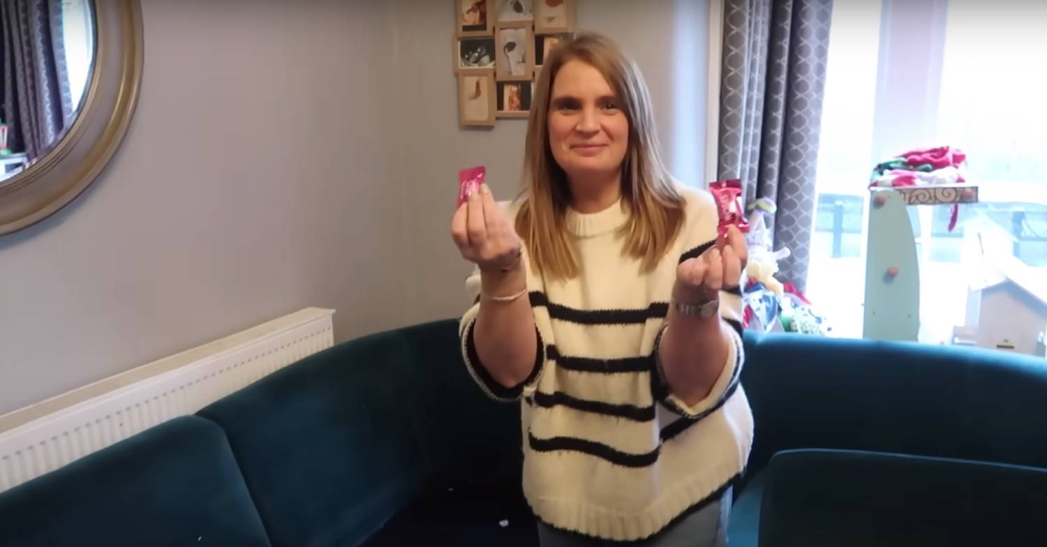 Sue Radford holds up two sweets