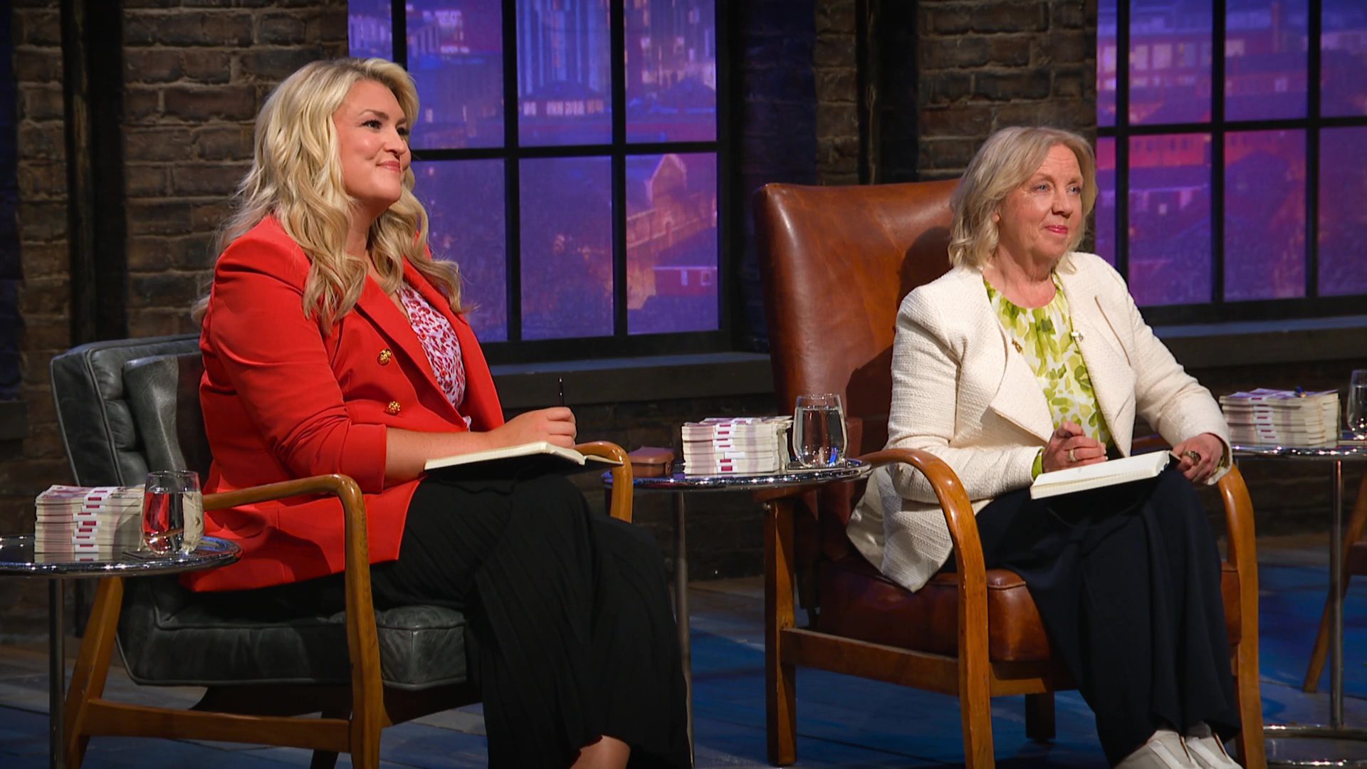 Sara Davies and Deborah Meaden listening to a pitch on Dragons' Den