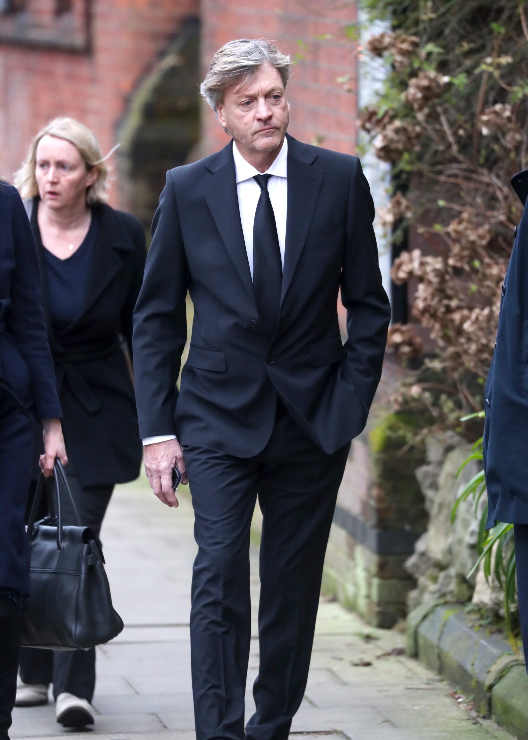 Richard Madeley arrives at Derek Draper's funeral