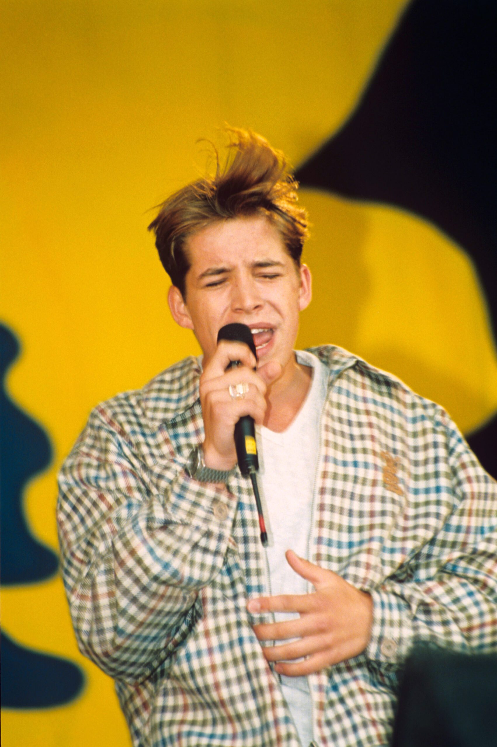 Sean Maguire singing during his pop career