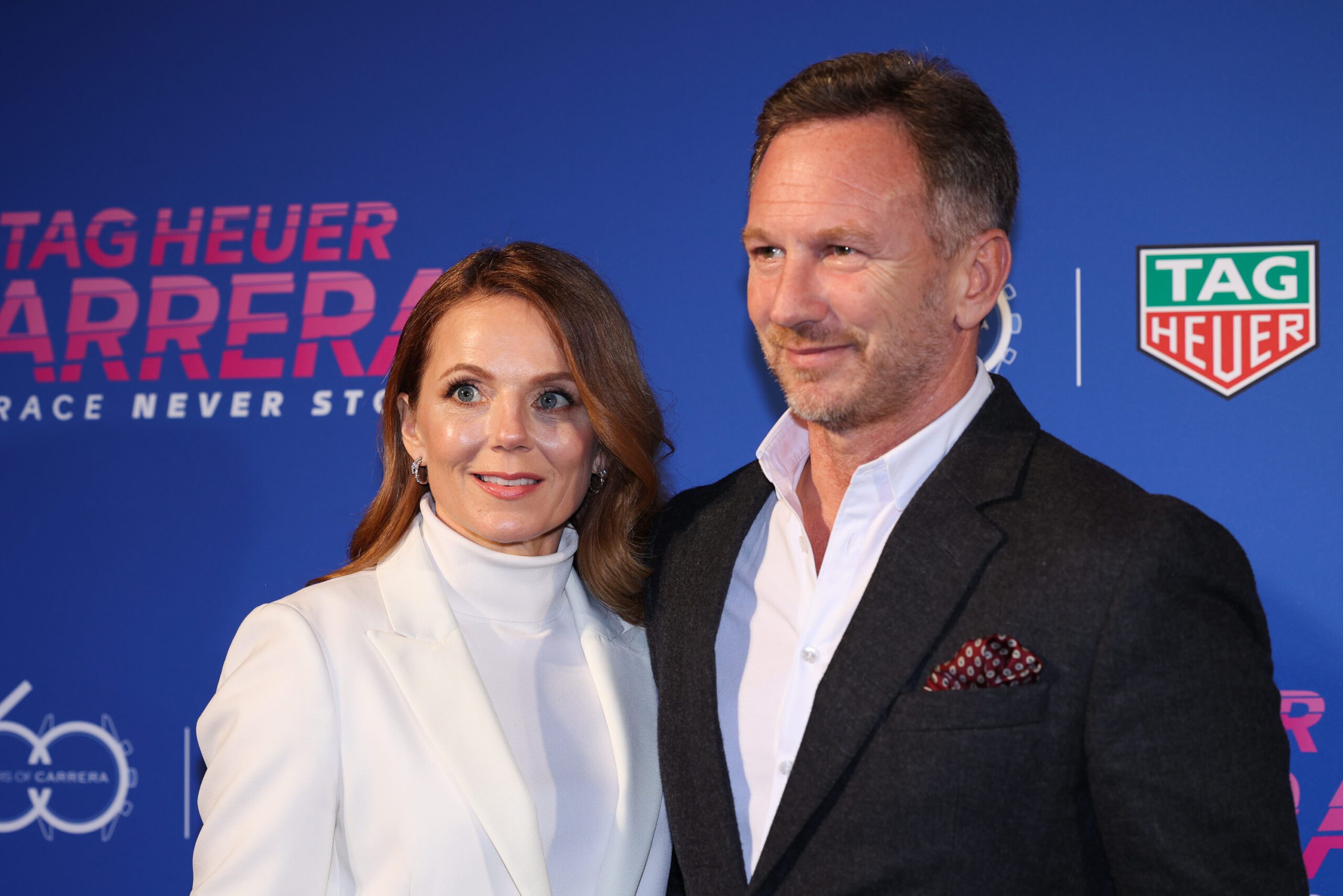 Geri Halliwell and husband Christian Horner on the red carpet smiling