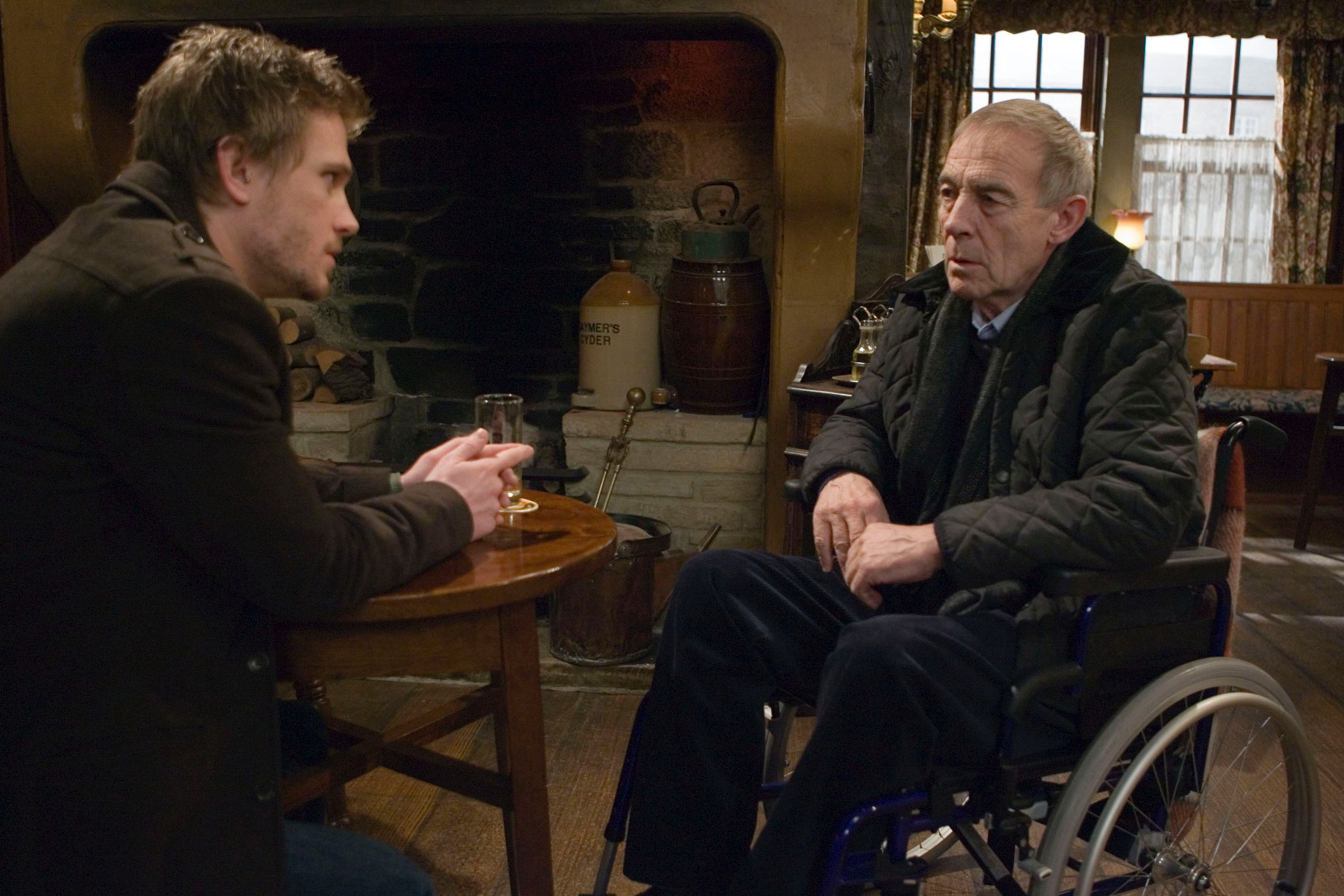 Emmerdale's Donald is speaking to David in the Woolpack