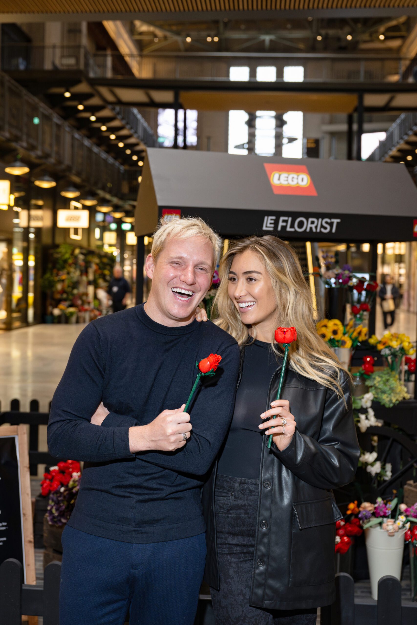 Jamie Laing and Sophie Habboo playing with Lego roses