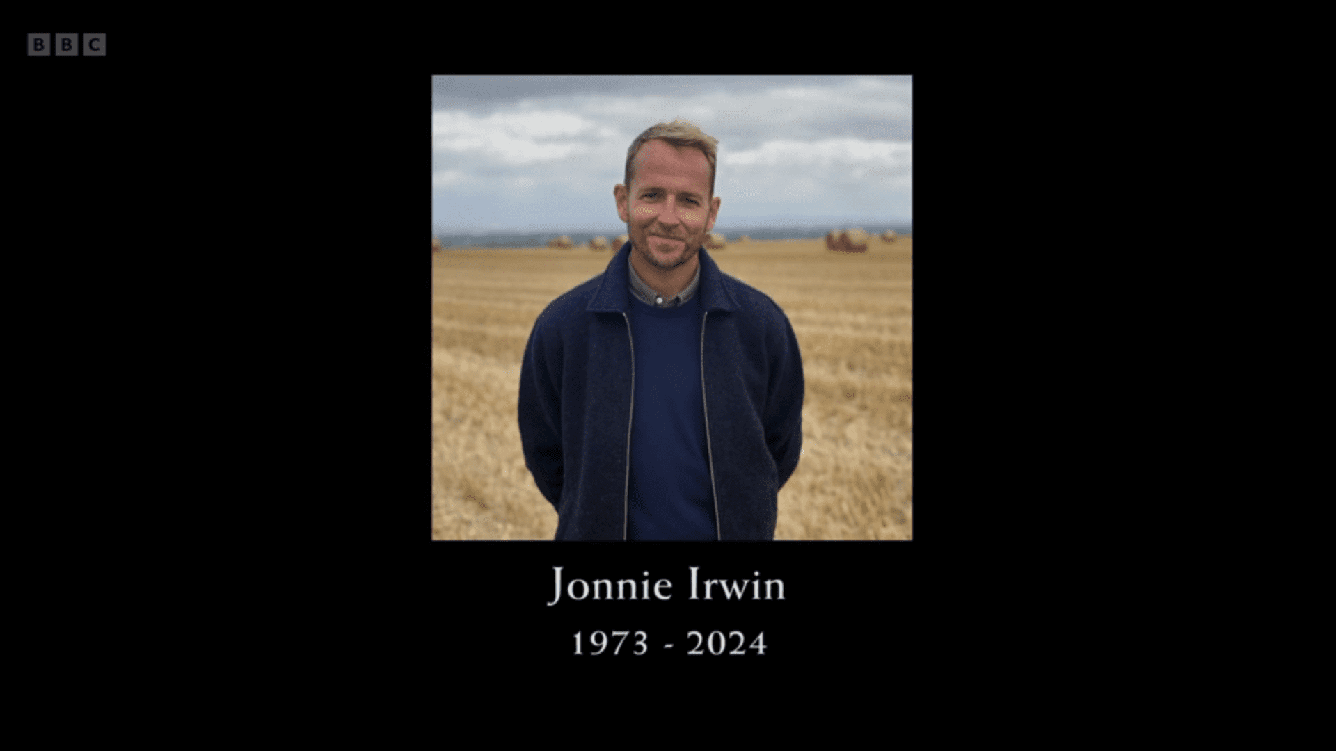 Jonnie Irwin smiling surrounded by a black border