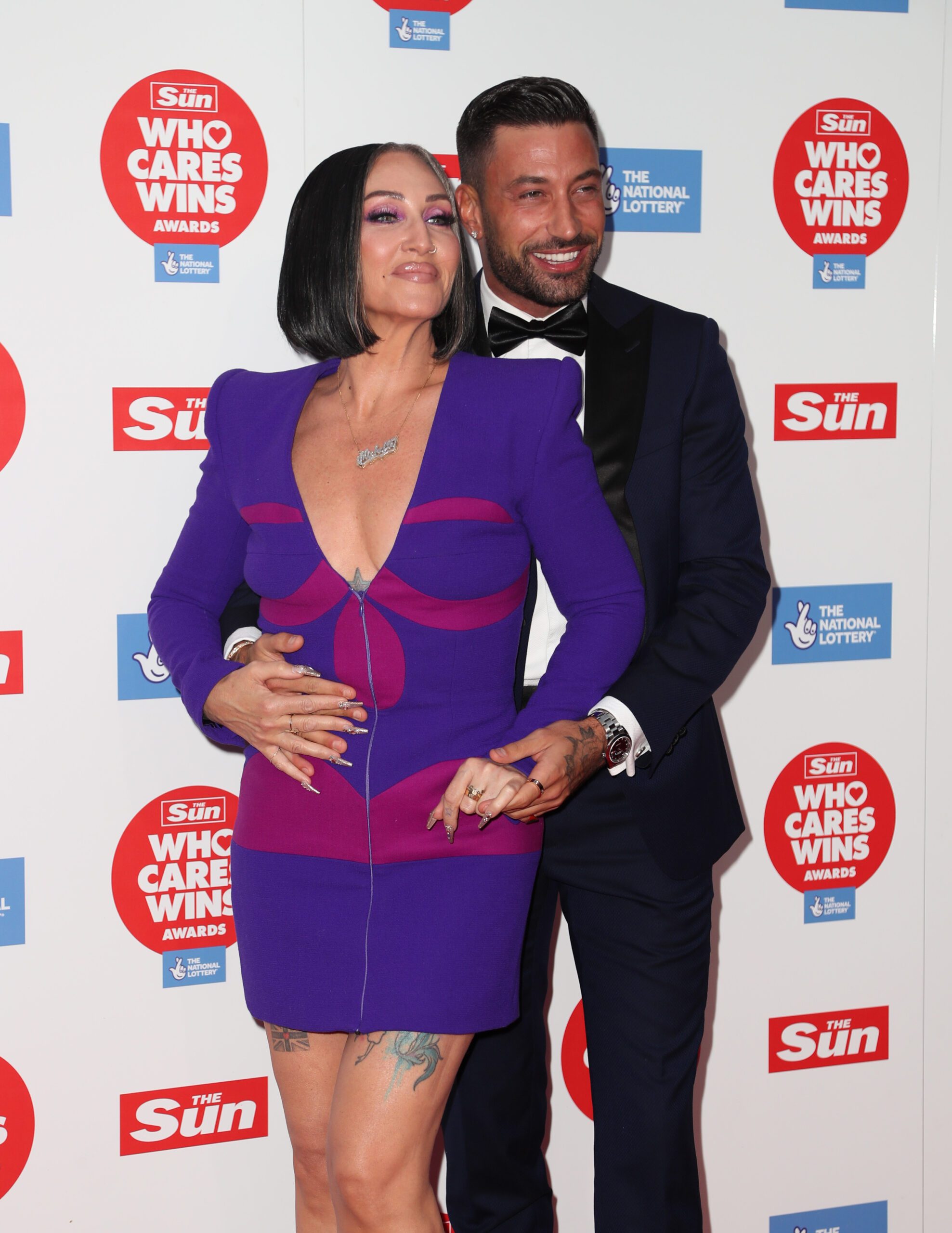 Michelle Visage cuddling Giovanni Pernice on the red carpet