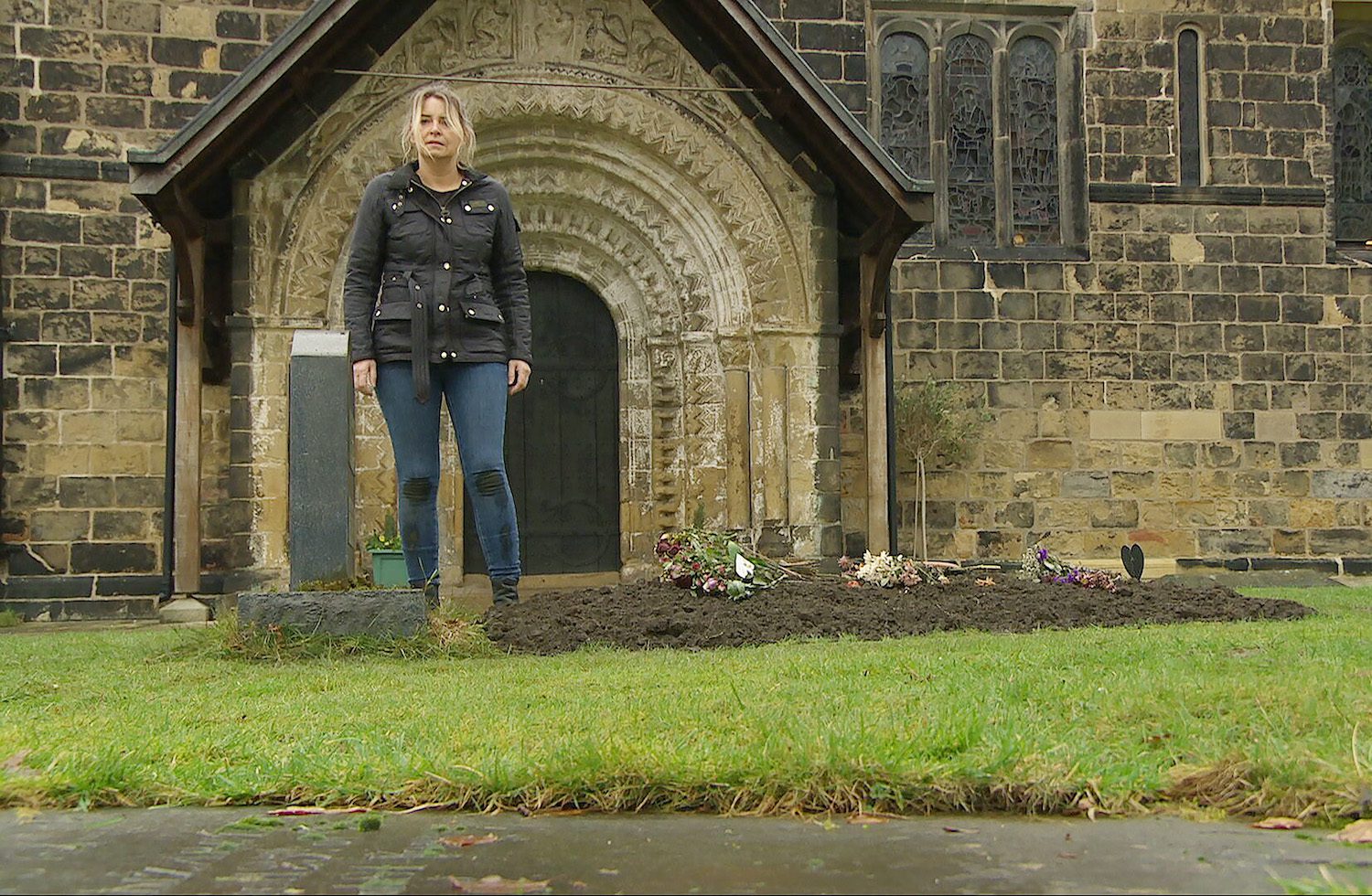 Charity looking over Harry's grave