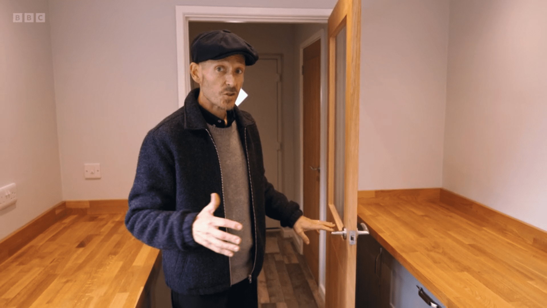 Jonnie Irwin presenting Escape to the Country in a cap