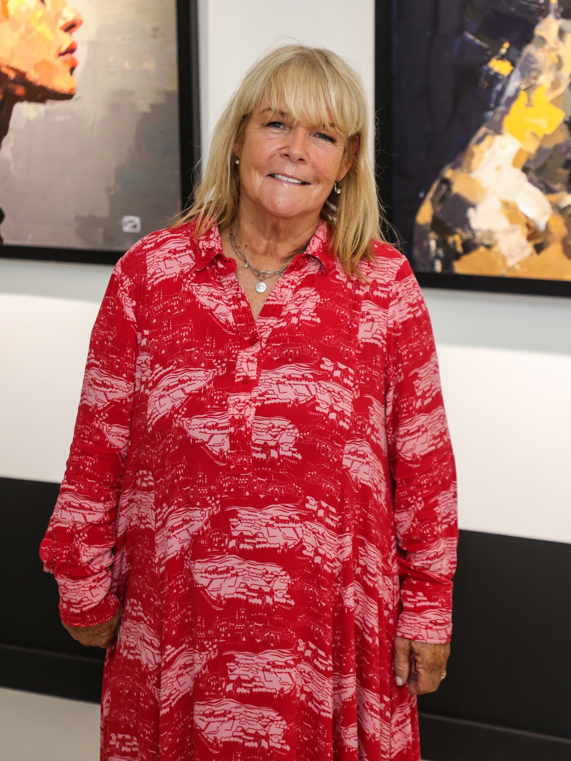Linda Robson smiling in red dress at event
