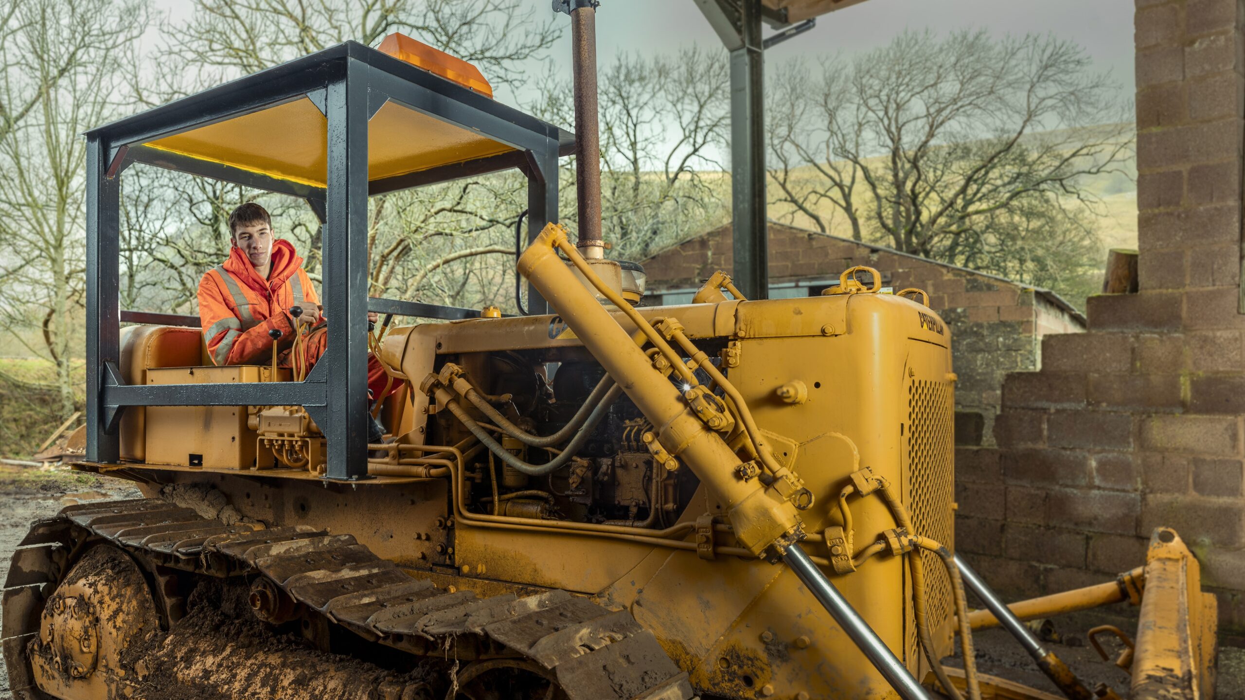 Reuben Owen, star of Reuben: Life in the Yorkshire Dales, in a big digger 