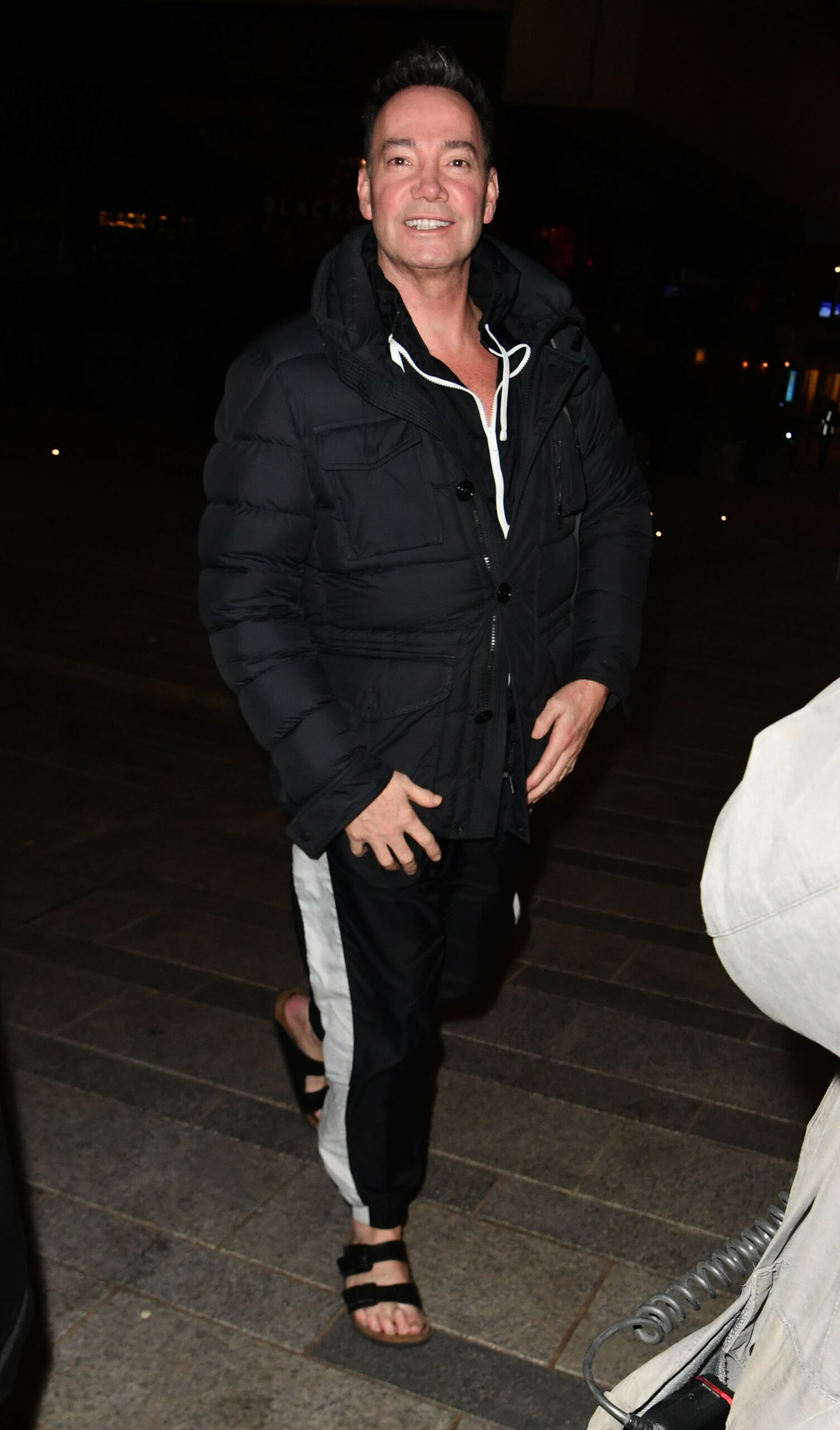 Strictly star Craig Revel Horwood smiling at cameras