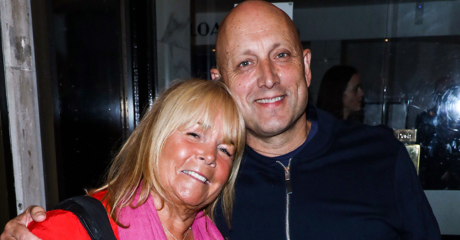 Linda Robson smiling with husband Mark