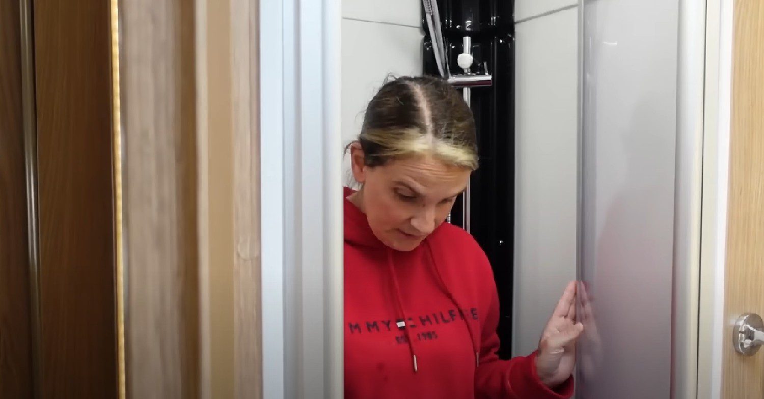 Sue Radford stood in shower in motorhome