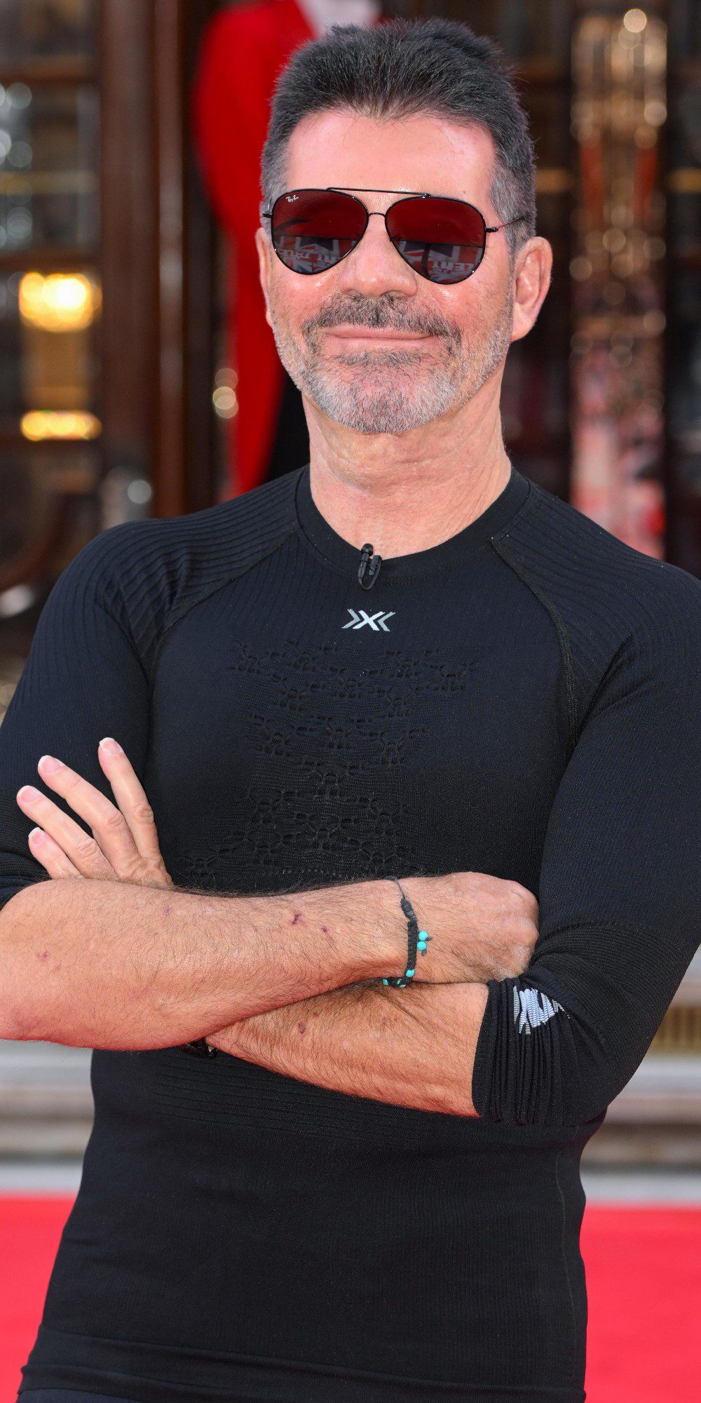 Simon Cowell with his arms folded