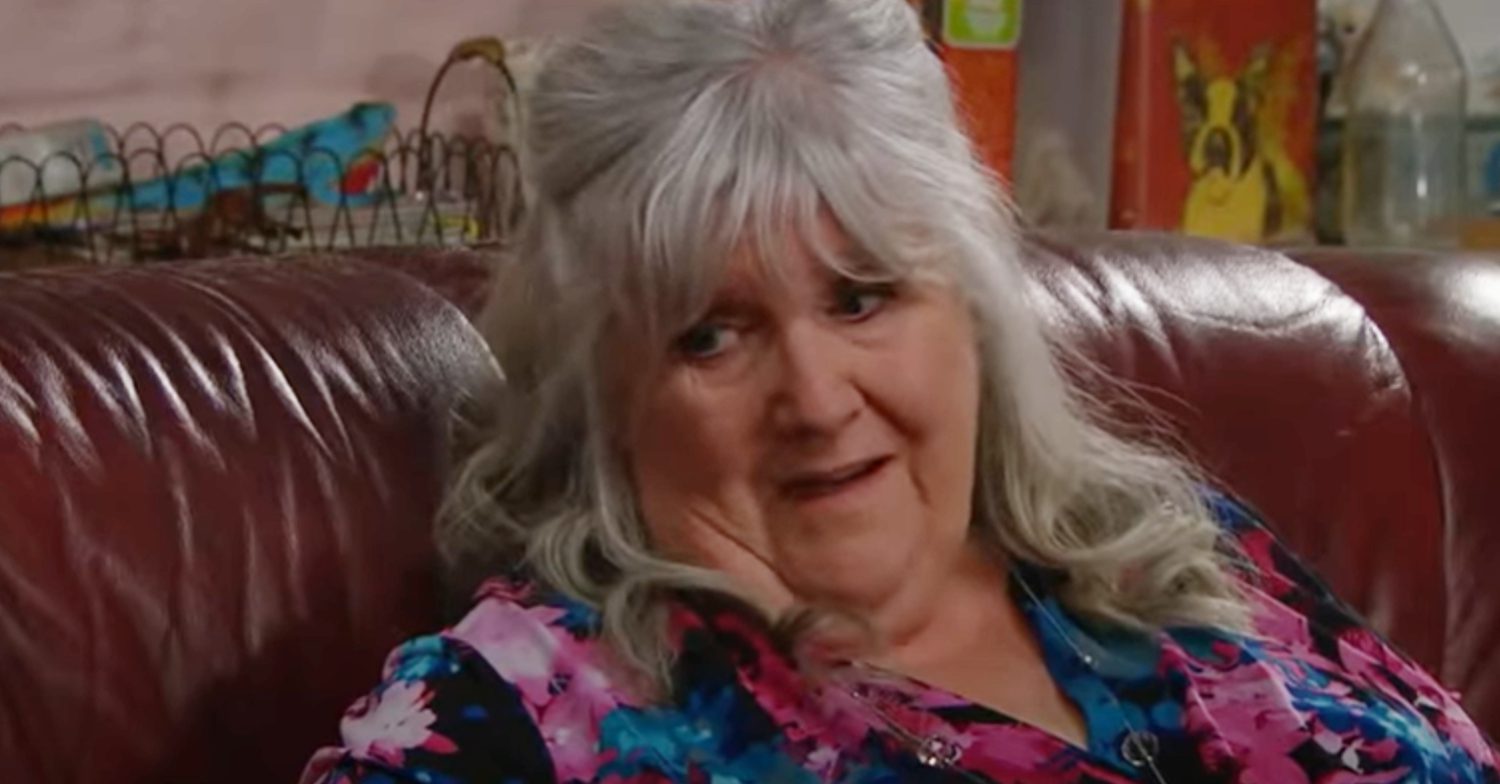 Emmerdale's Lisa is sitting on the sofa