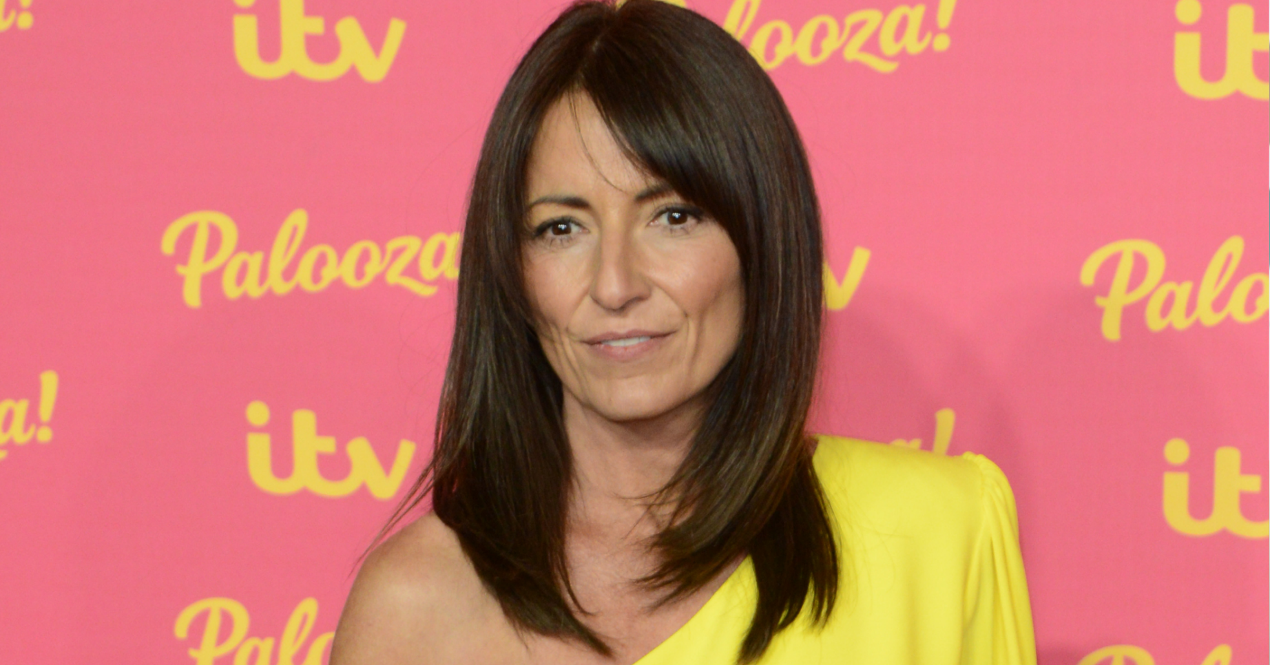 Davina McCall in a bright yellow dress