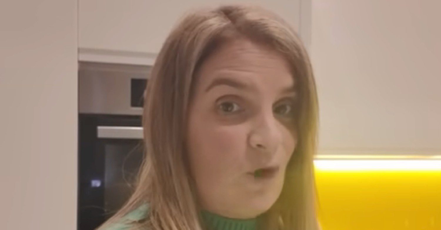 Sue Radford speaking in her kitchen