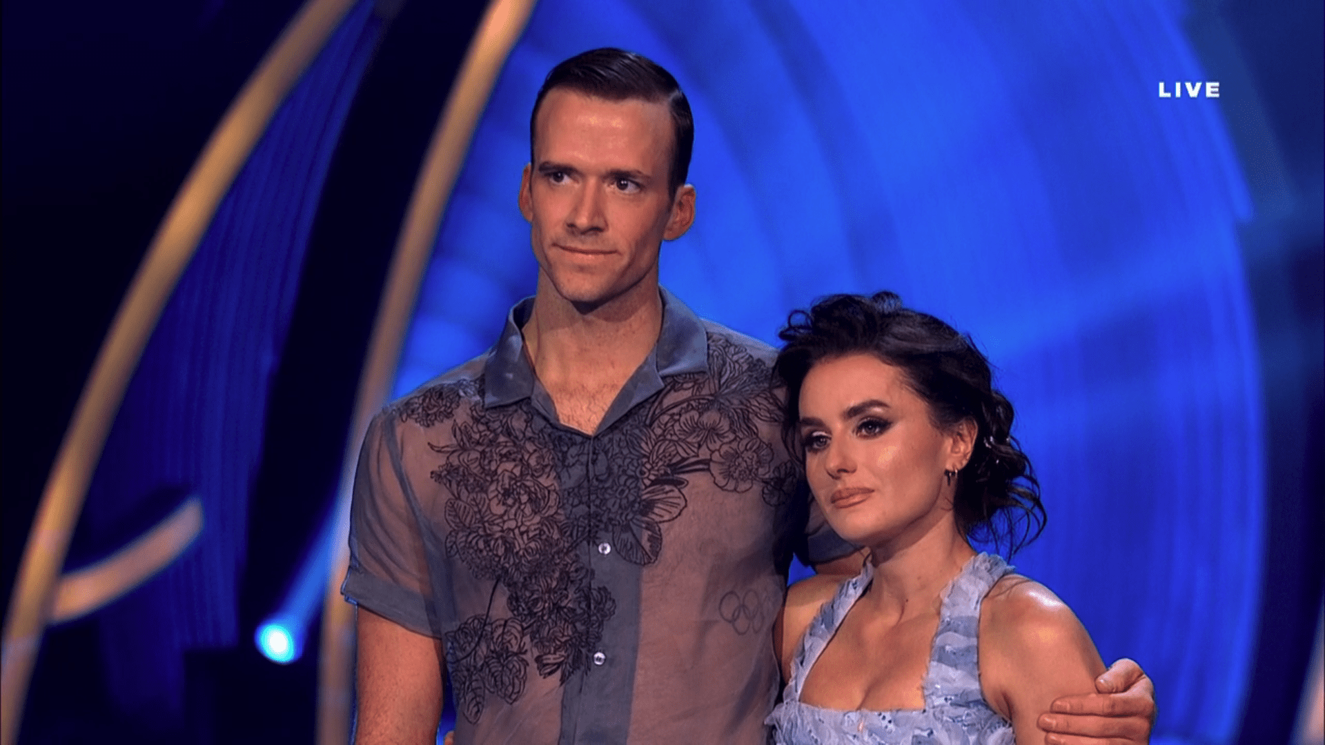 Amber Davis and her professional skating partner looking upset