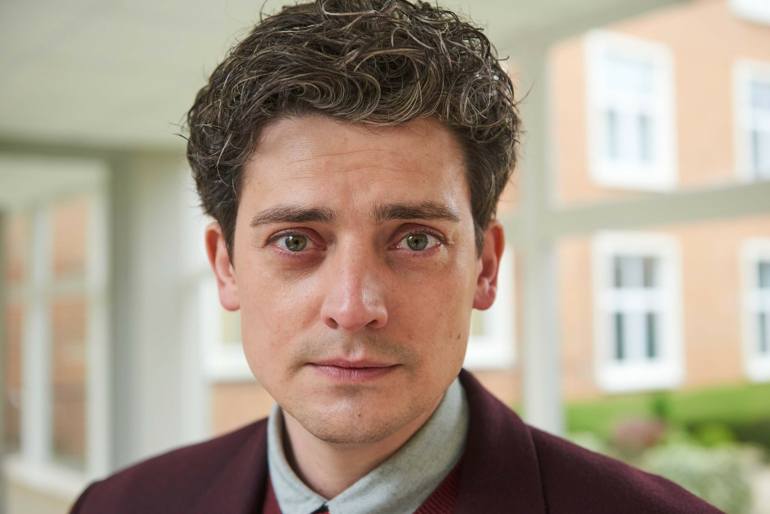 Aneurin Barnard in Men Up, staring straight at the camera