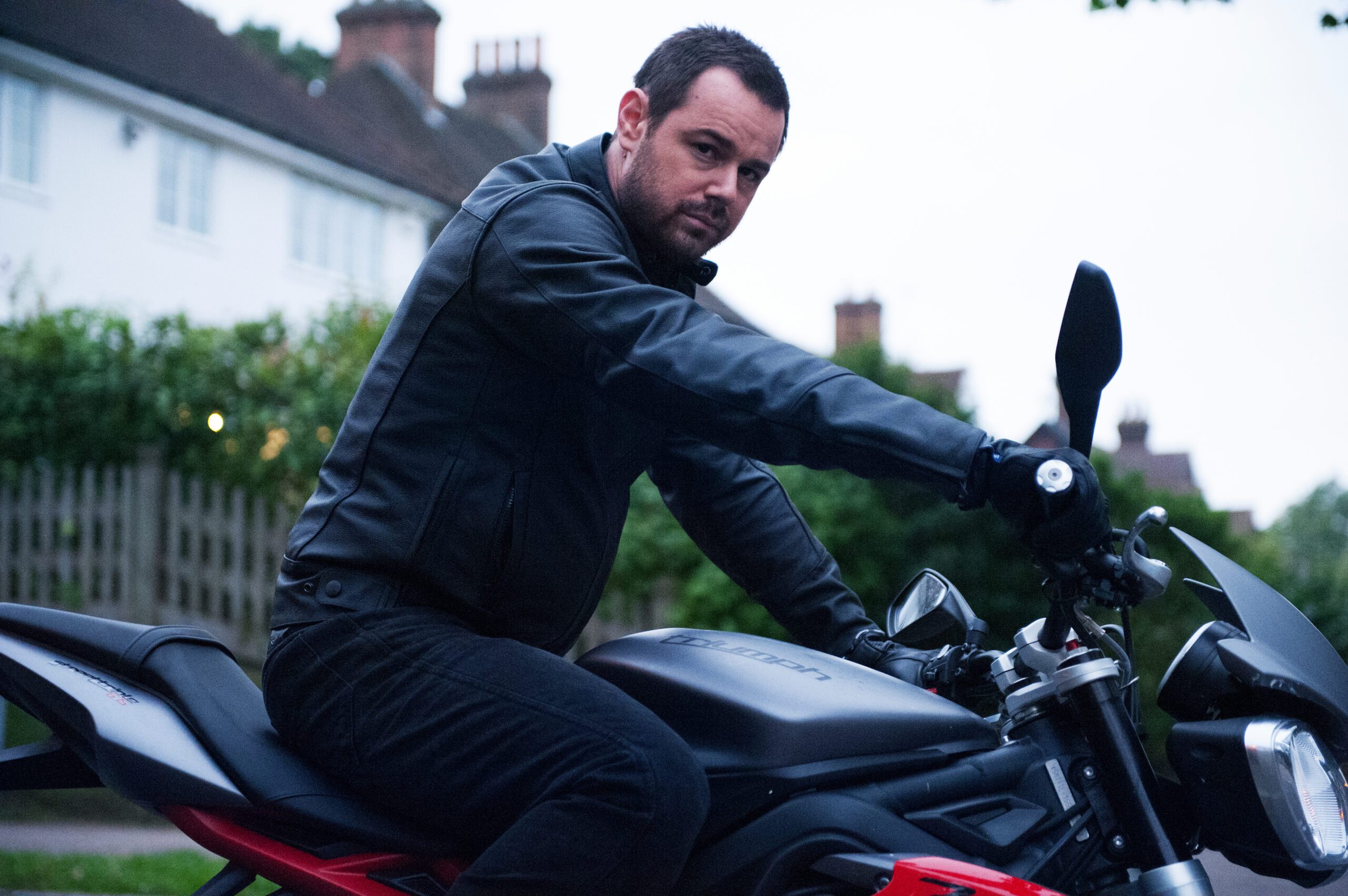 Danny Dyer dressed in leathers riding a motorbike for the 2015 movie Assassin