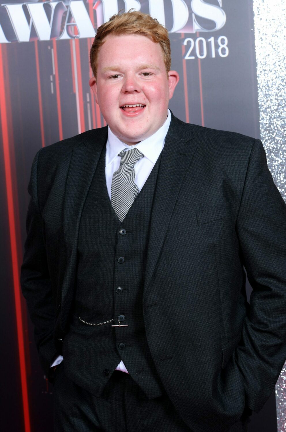 Craig Tinker actor Colson smiles on the red carpet at the British Soap Awards in 2018