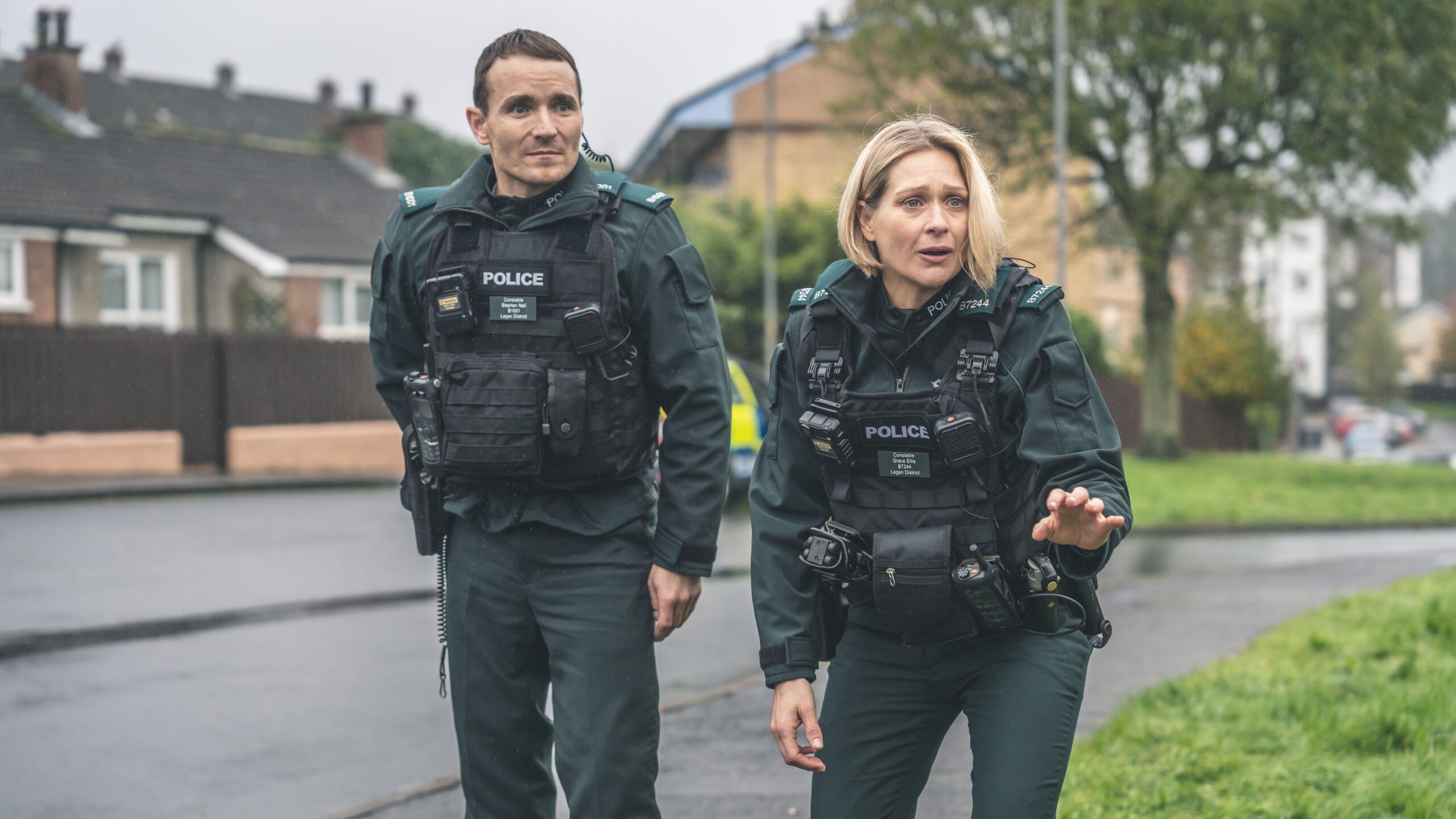 Martin McCann as Stevie Neil and Sian Brooke as Grace Ellis wearing police uniform in candid shot