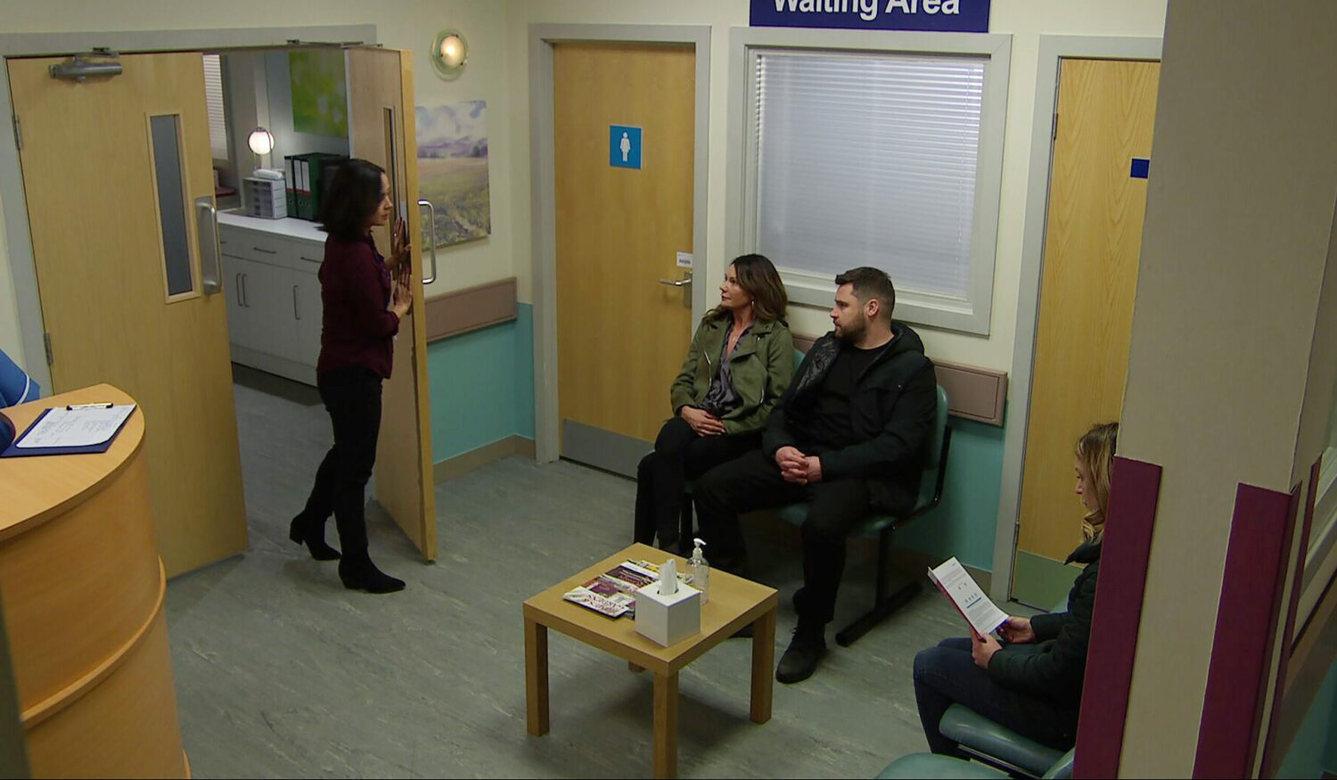 Emmerdale's Chas and Aaron are sitting together in the hospital waiting room