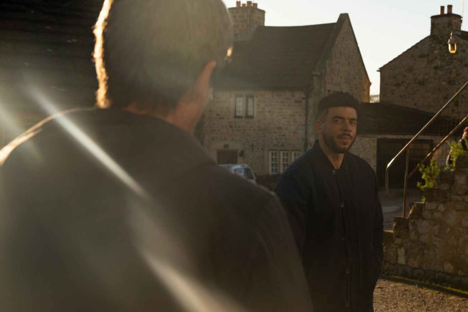 Nate looks suspiciously at Cain in Emmerdale