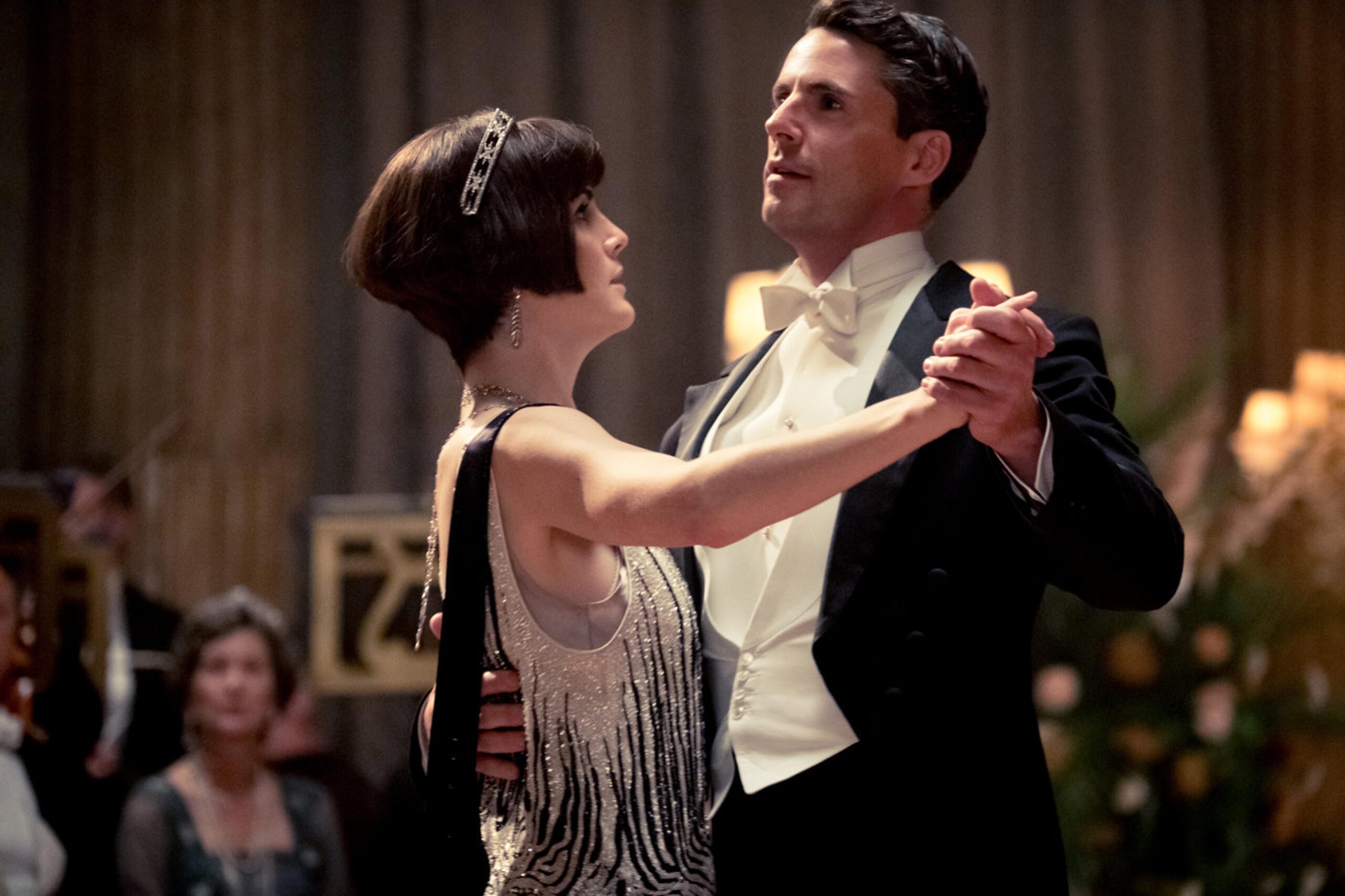 Matthew Goode and Michelle Dockery dancing together in Downton Abbey (2019) film