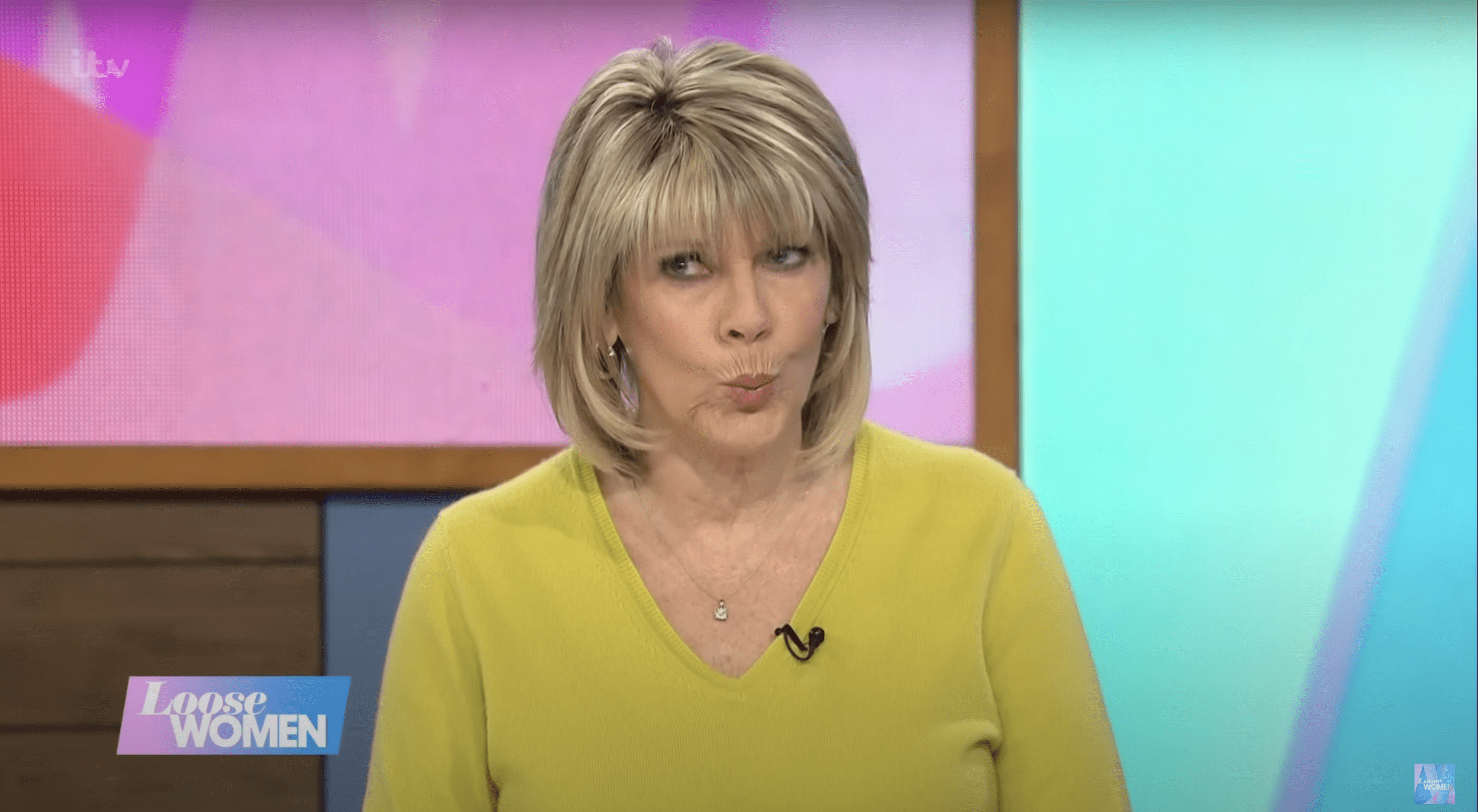 Ruth Langsford with a cheeky expression wearing a green jumper on Loose Women