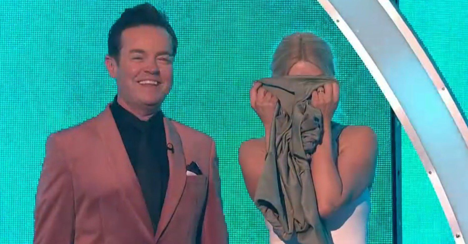 Holly Willoughby covering her face with a T-shirt on Dancing On Ice