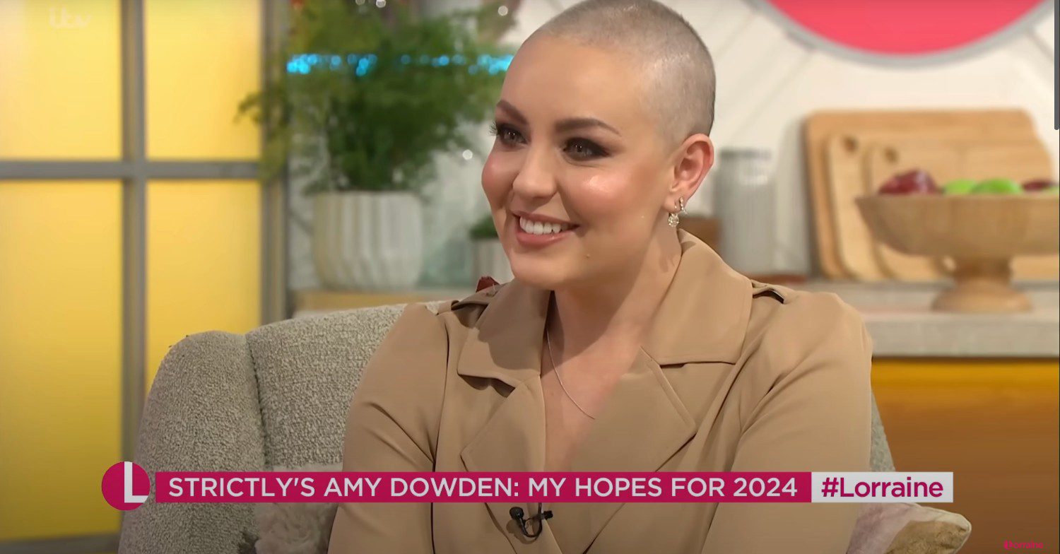 Amy Dowden smiling and wearing a nude suit on set of Lorraine 