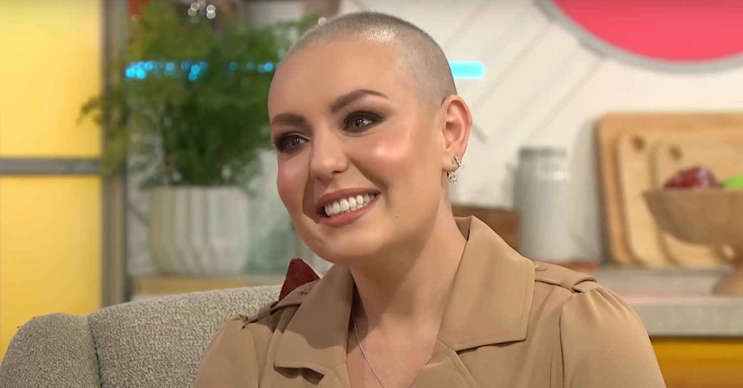 Amy Dowden smiling and wearing a nude suit on set of Lorraine